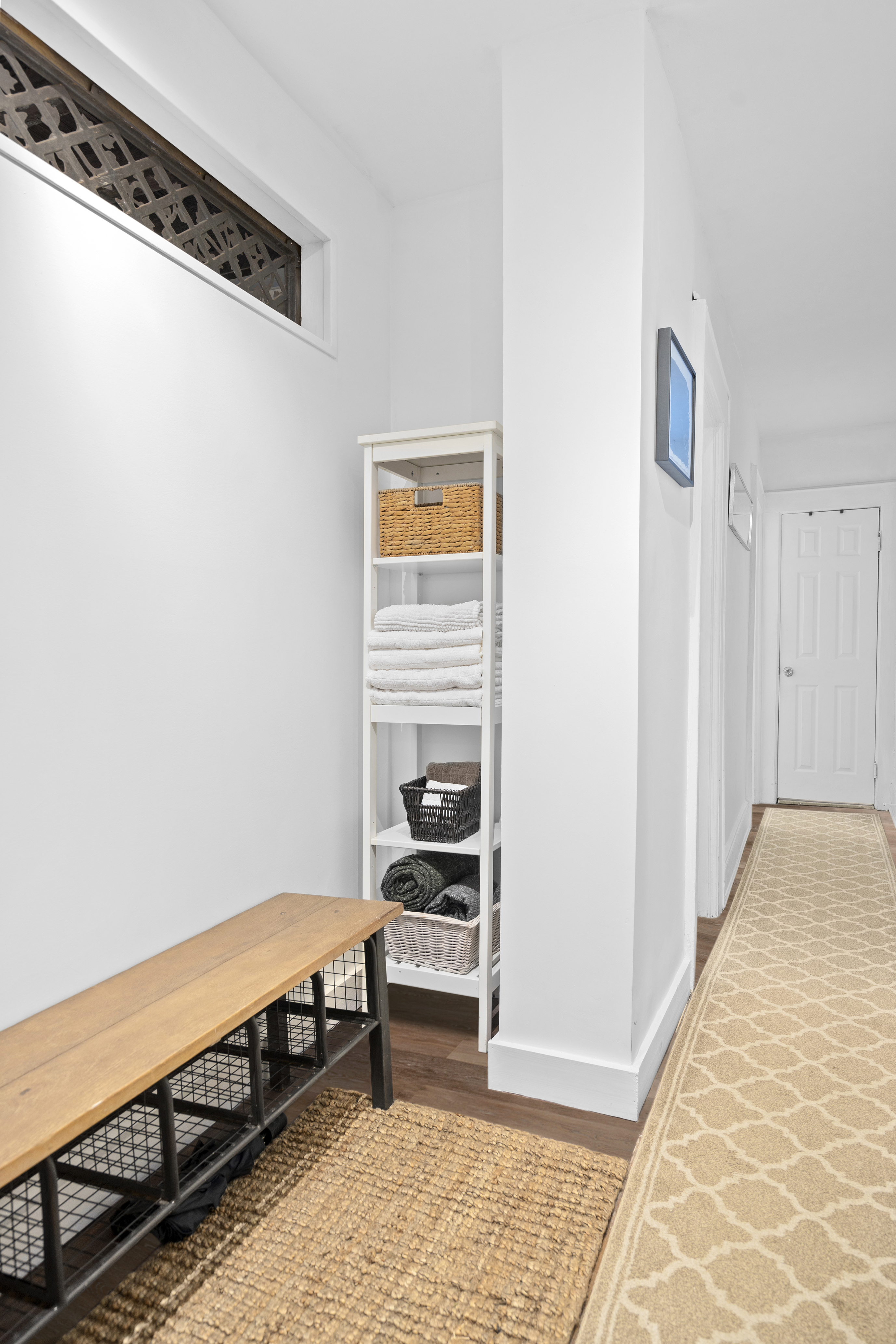 825 East 21st Street Brooklyn, NY 11210 - Photo 14 of 22 a bedroom with a bed and a window