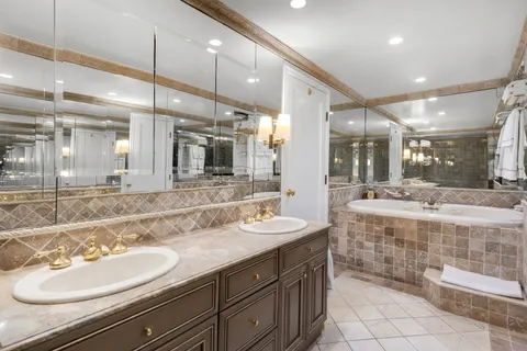 a bathroom with a sink double vanity and a mirror