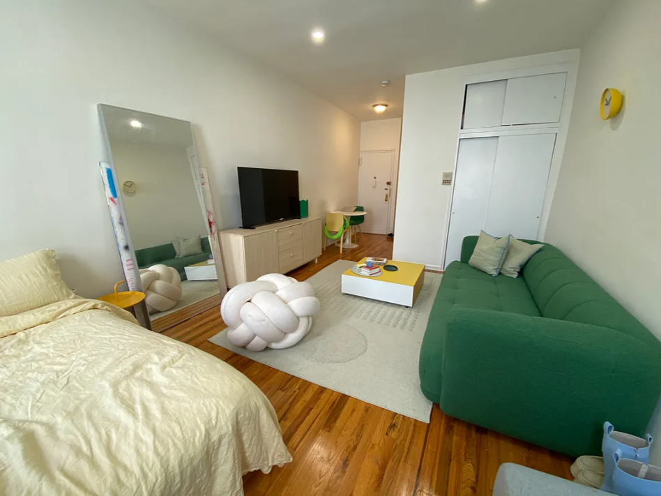 1728 2nd Avenue, Unit 3C Manhattan, NY 10128 - Photo 2 of 4 a bedroom with 2 bed and a flat screen tv