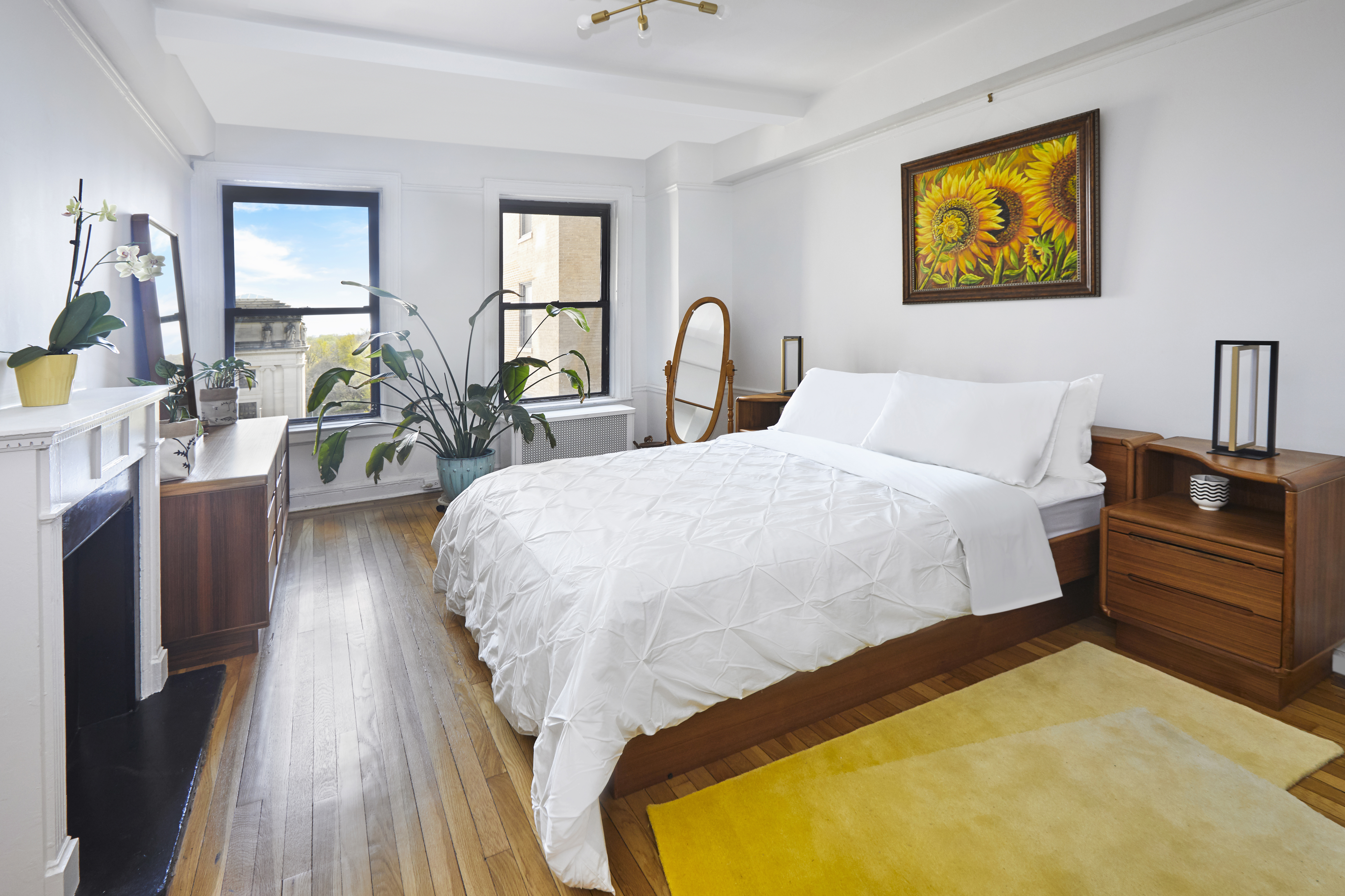 135 Eastern Parkway, Unit 9I Brooklyn, NY 11238 - Photo 9 of 17 a bedroom with a bed and wooden floor