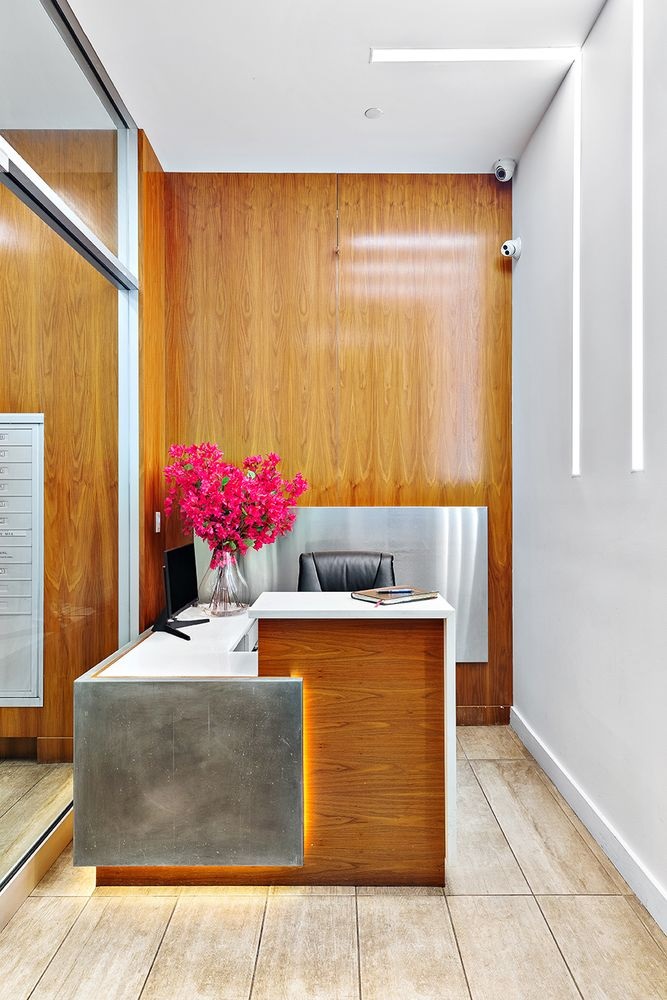 133 Mulberry Street, Unit 5A Manhattan, NY 10013 - Photo 11 of 15 a living room with stainless steel appliances kitchen island granite countertop furniture and a potted plant
