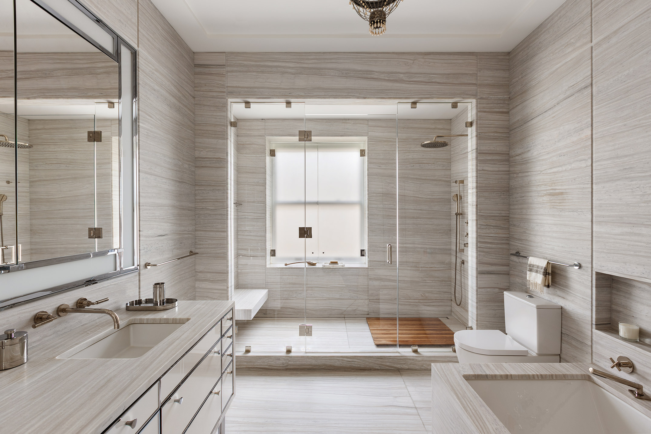 225 West 86th Street, Unit 1005 Manhattan, NY 10024 - Photo 8 of 15 a bathroom with a tub sink and mirror