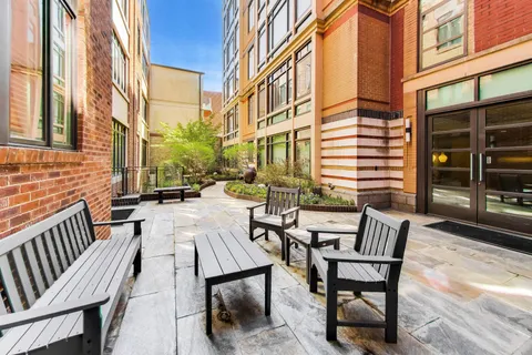 a view of a patio with a table and chairs and wooden floor