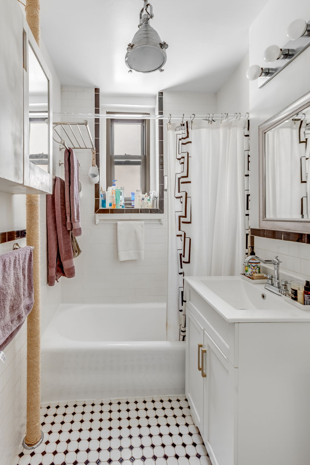 345 East 77th Street, Unit 3C Manhattan, NY 10075 - Photo 7 of 8 a bathroom with a bathtub sink and mirror