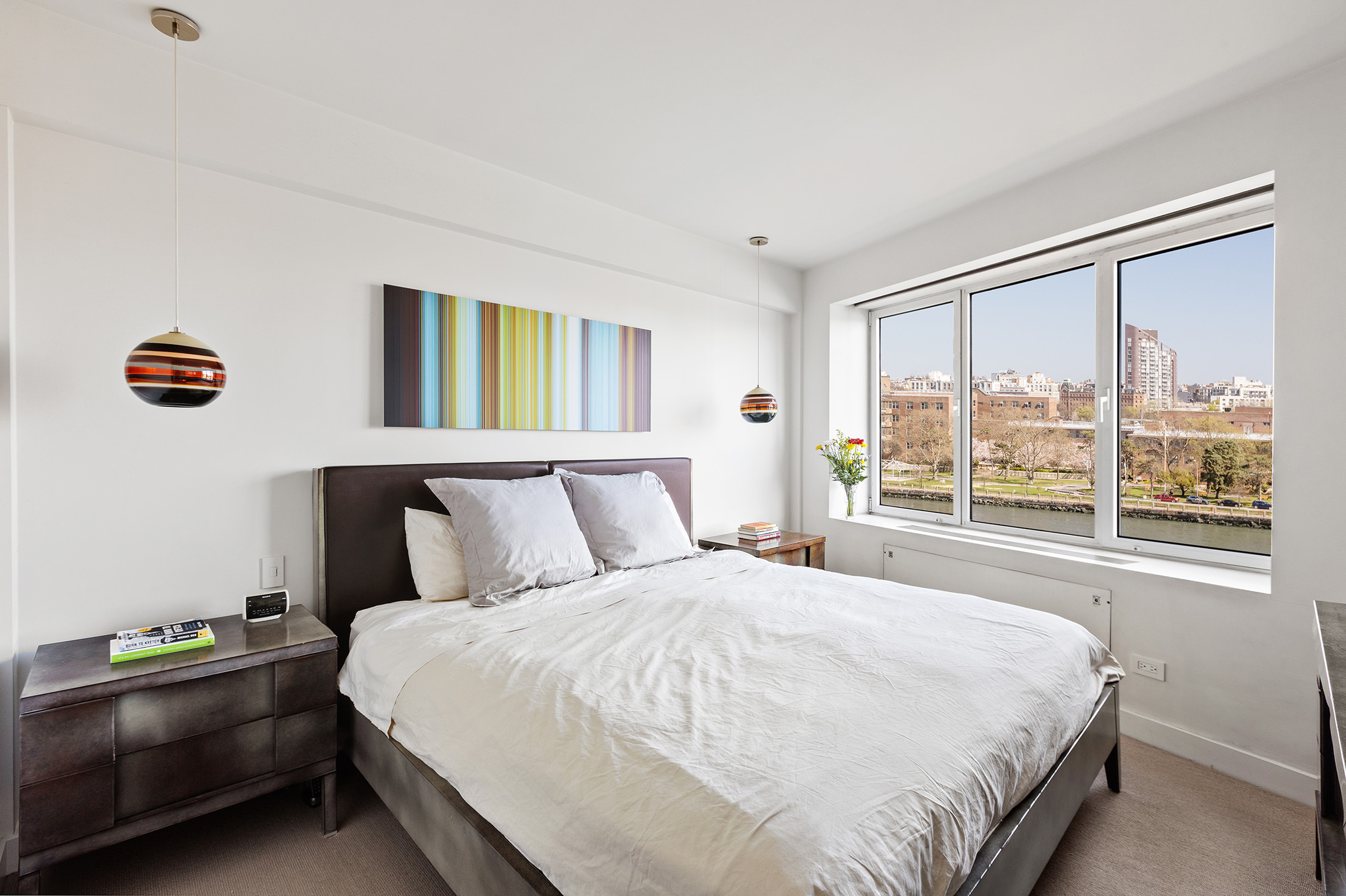 45 East End Avenue, Unit 6/7B Manhattan, NY 10028 - Photo 8 of 17 a bedroom with a bed and a large window