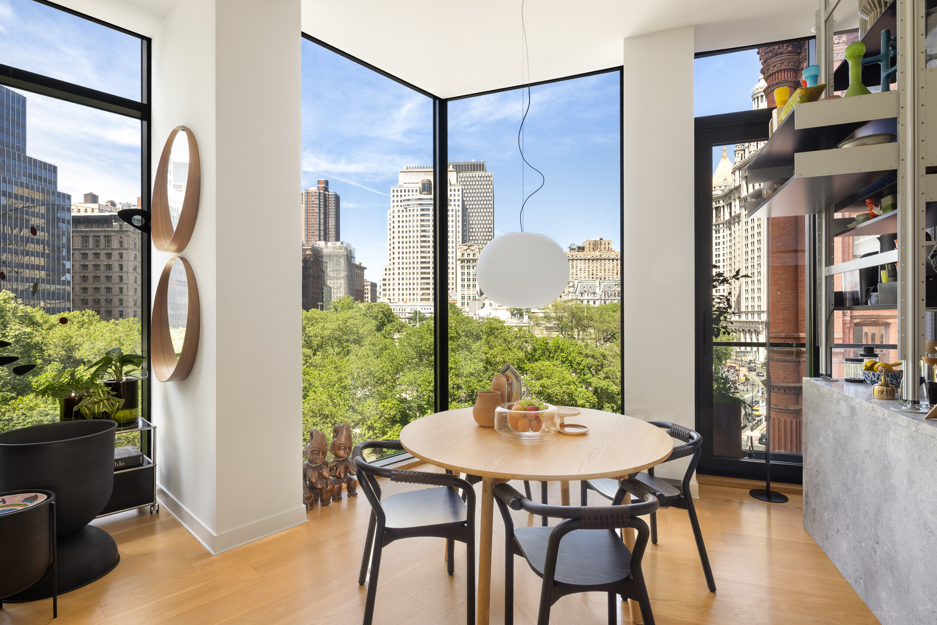 33 Park Row, Unit 6B Manhattan, NY 10038 - Photo 3 of 20 a view of a dining room with furniture window and wooden floor