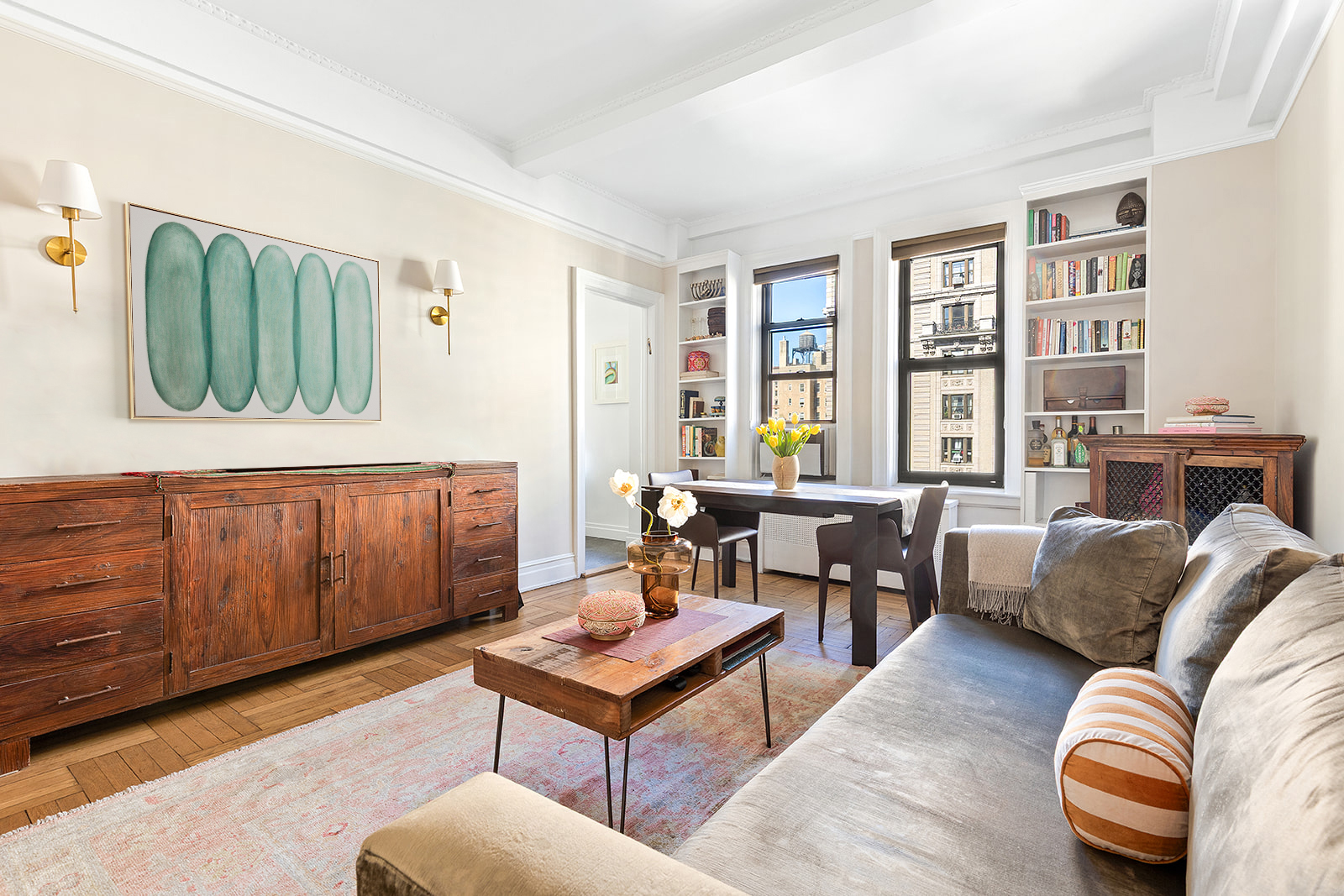 a living room with furniture a fireplace and a window