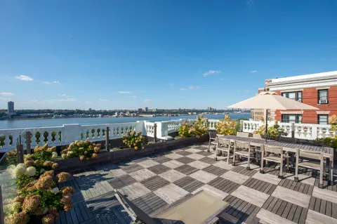 a picture of floor with a white wall and a painting