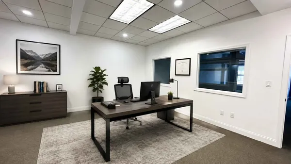 a workspace with furniture and window