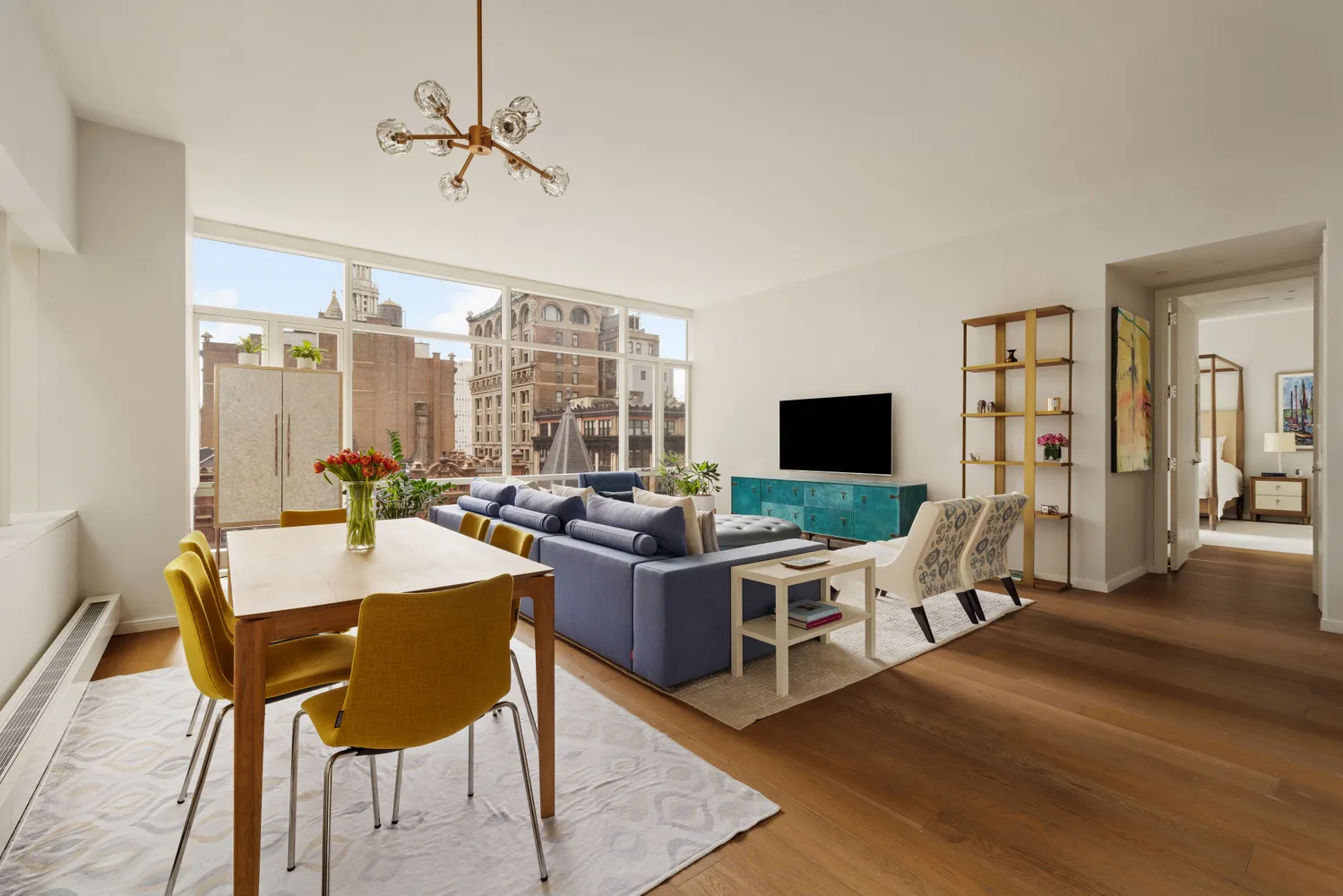 a view of a room with a table and chairs