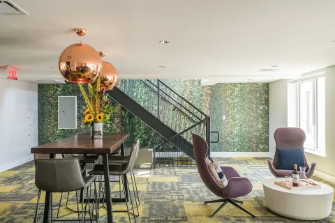 a view of a hallway with seating area