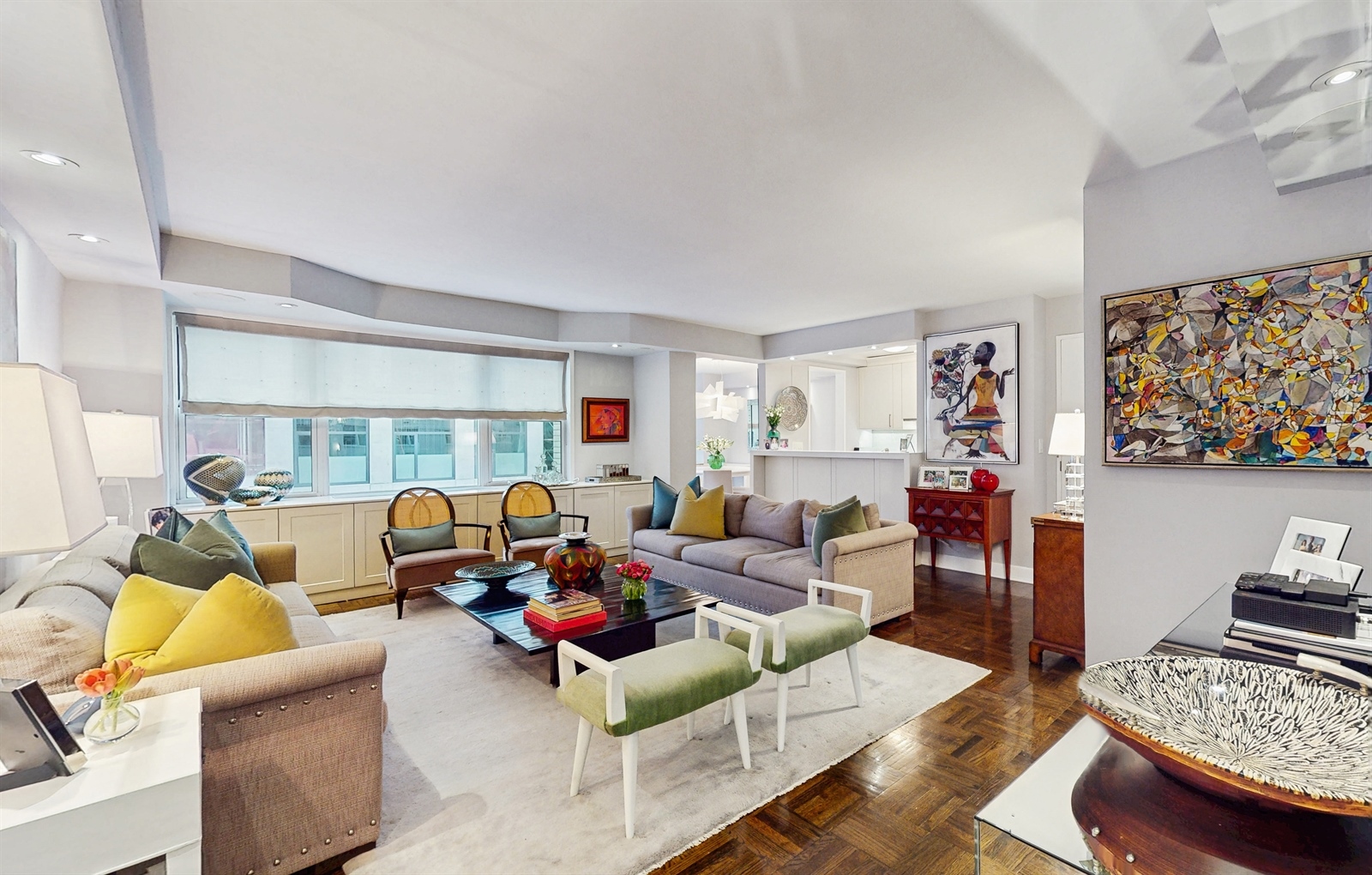 136 East 56th Street, Unit 16B Manhattan, NY 10022 - Photo 2 of 11 a living room with furniture window and a table