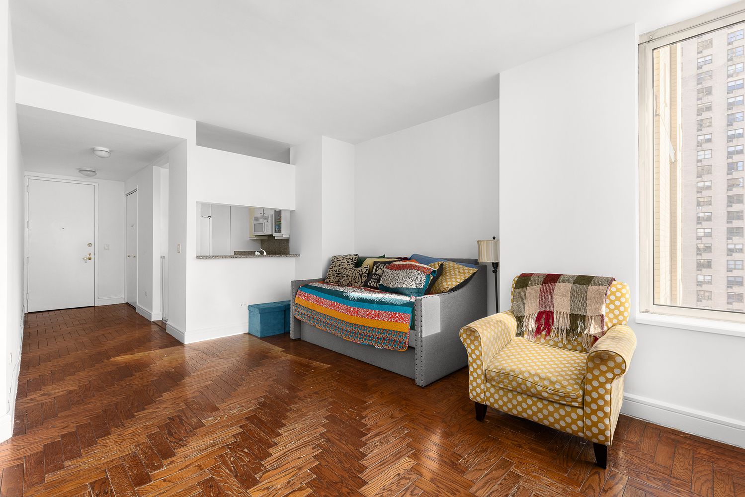 a bedroom with furniture and window