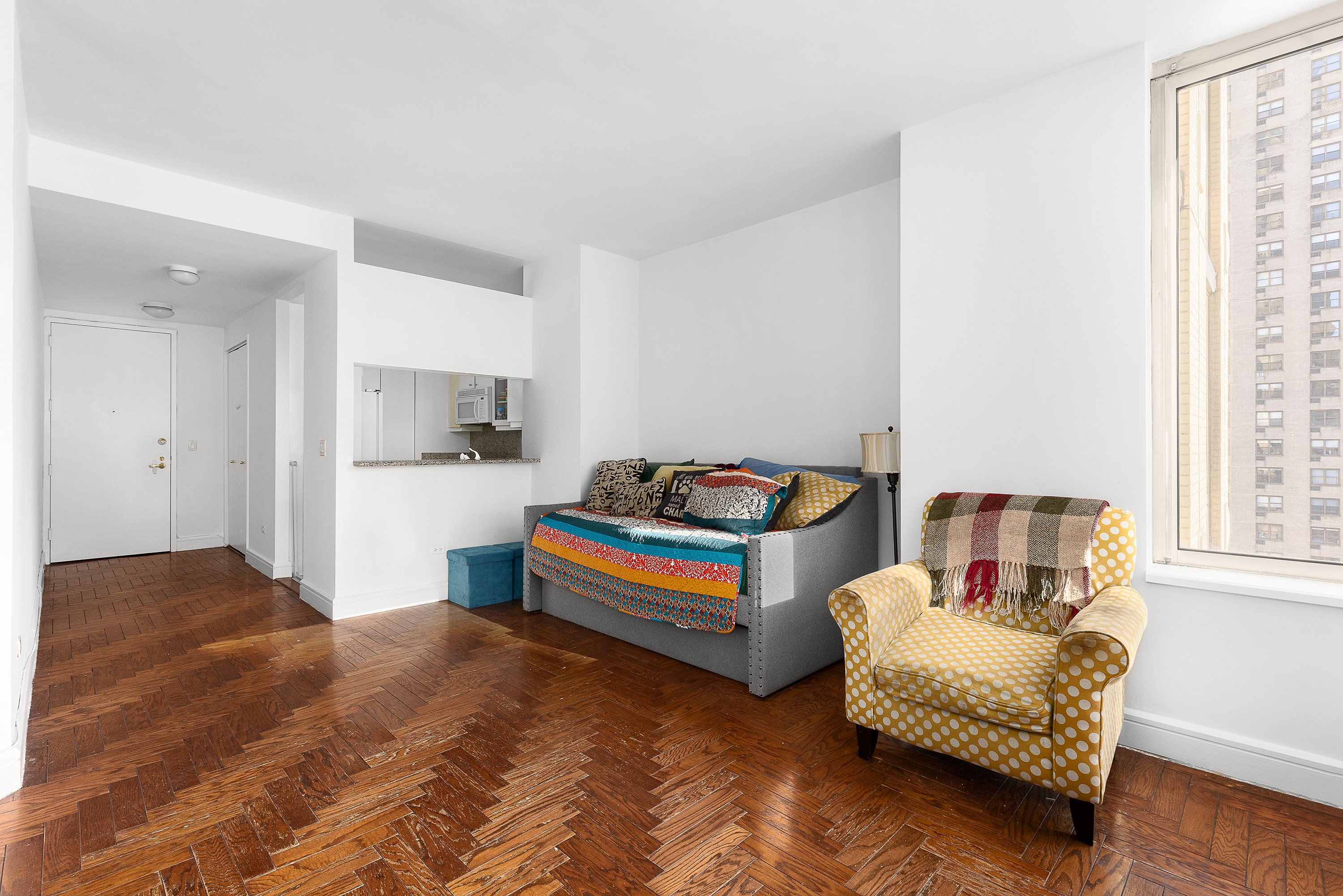 200 Riverside Boulevard, Unit 15F Manhattan, NY 10069 - Photo 6 of 11 a bedroom with furniture and window