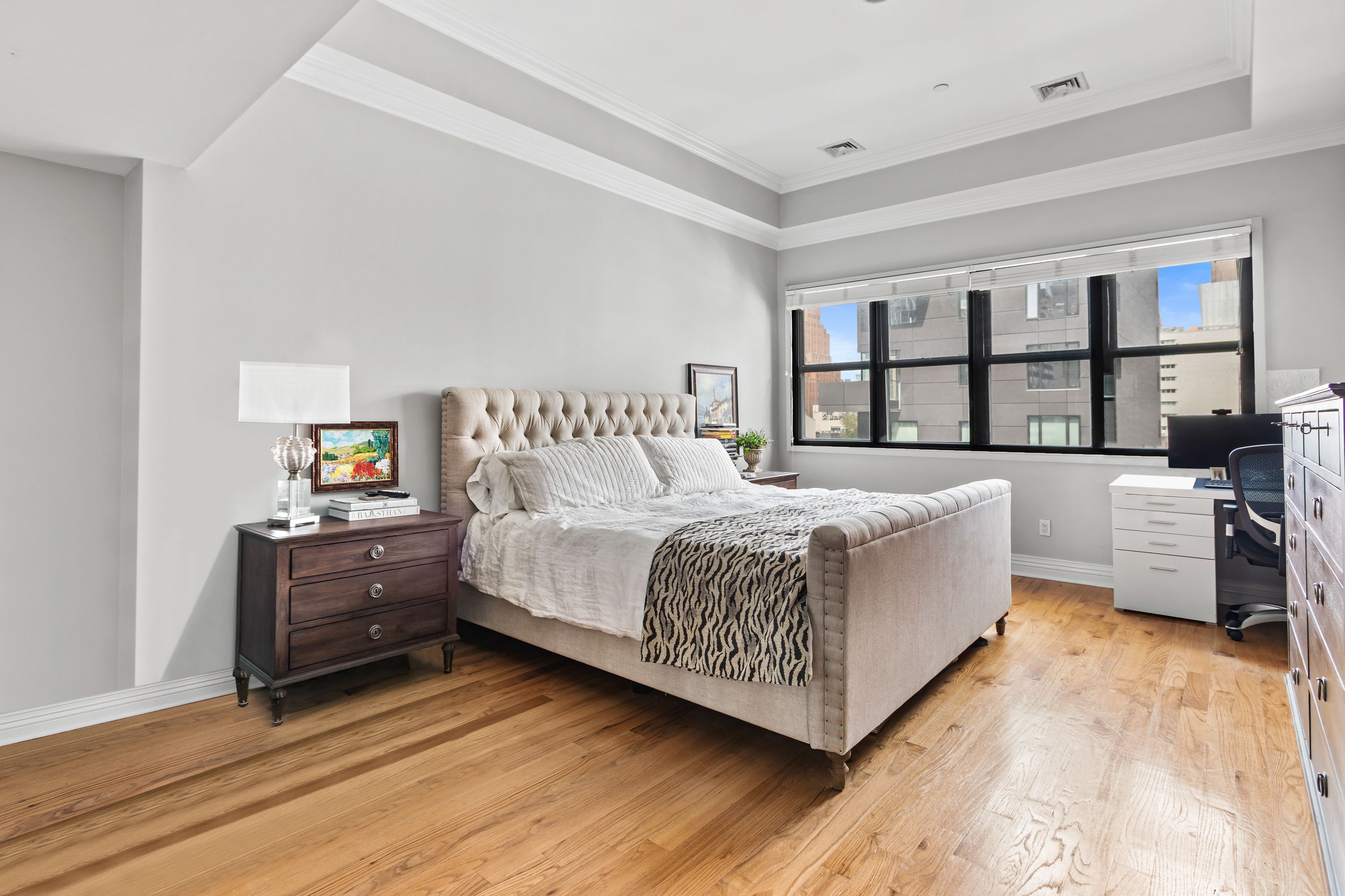 25 Murray Street, Unit 8F Manhattan, NY 10007 - Photo 6 of 10 a bedroom with a bed and a couch