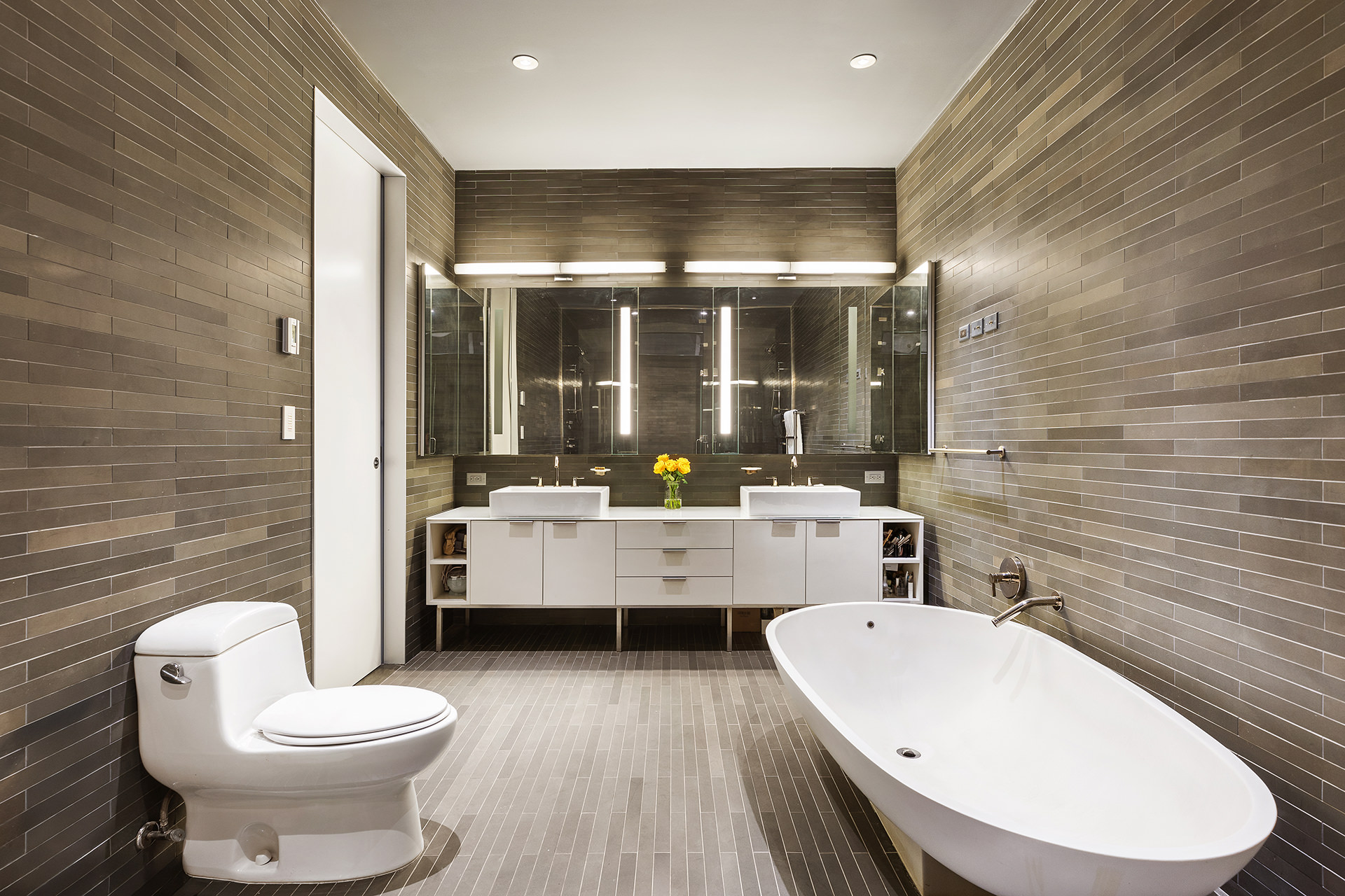 25 Bond Street, Unit 3E Manhattan, NY 10012 - Photo 13 of 23 a bathroom with a toilet a sink and mirror