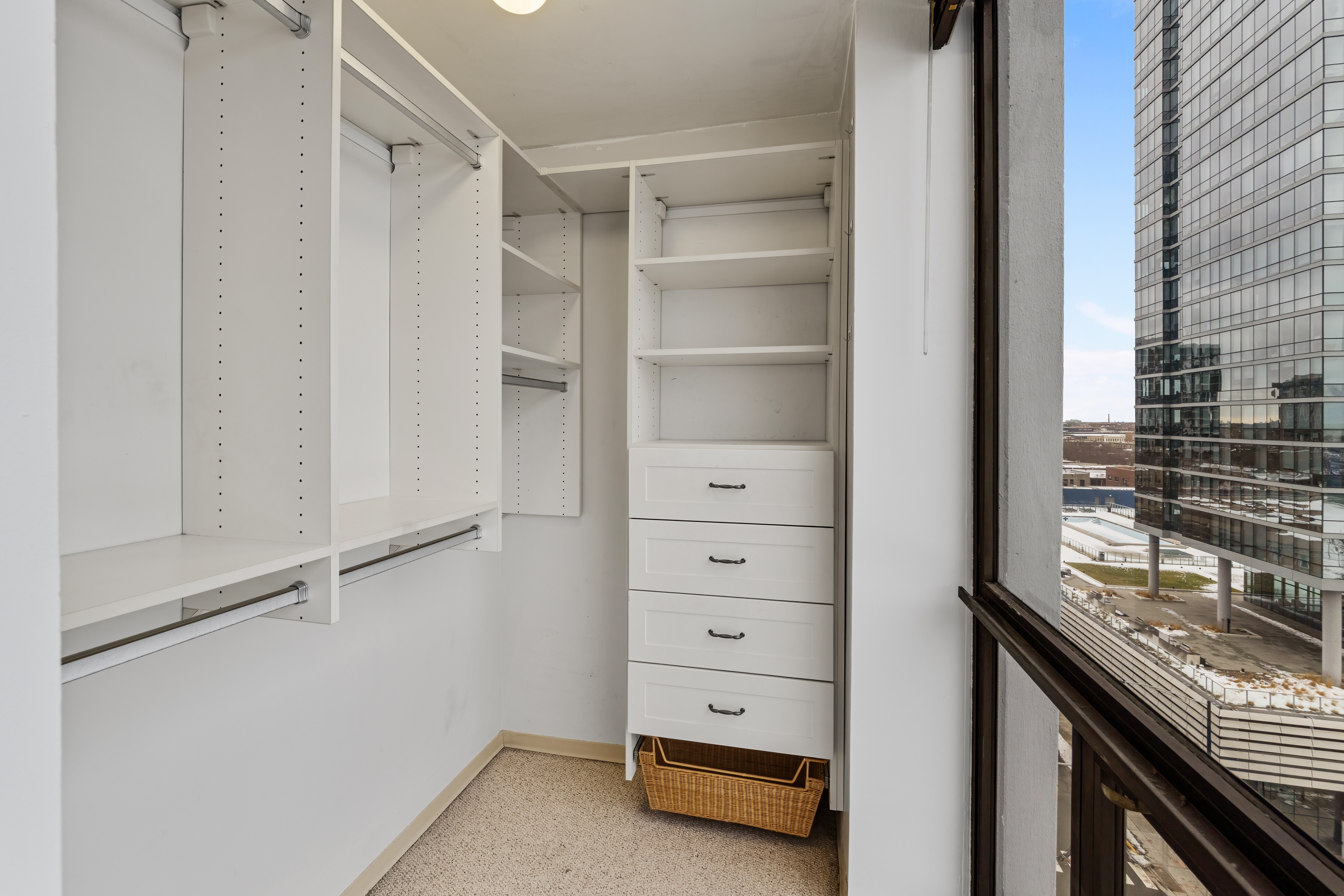 4343 North Clarendon Avenue, Unit 1016 Chicago, IL 60613 - Photo 25 of 35 a view of walk in closet with empty racks