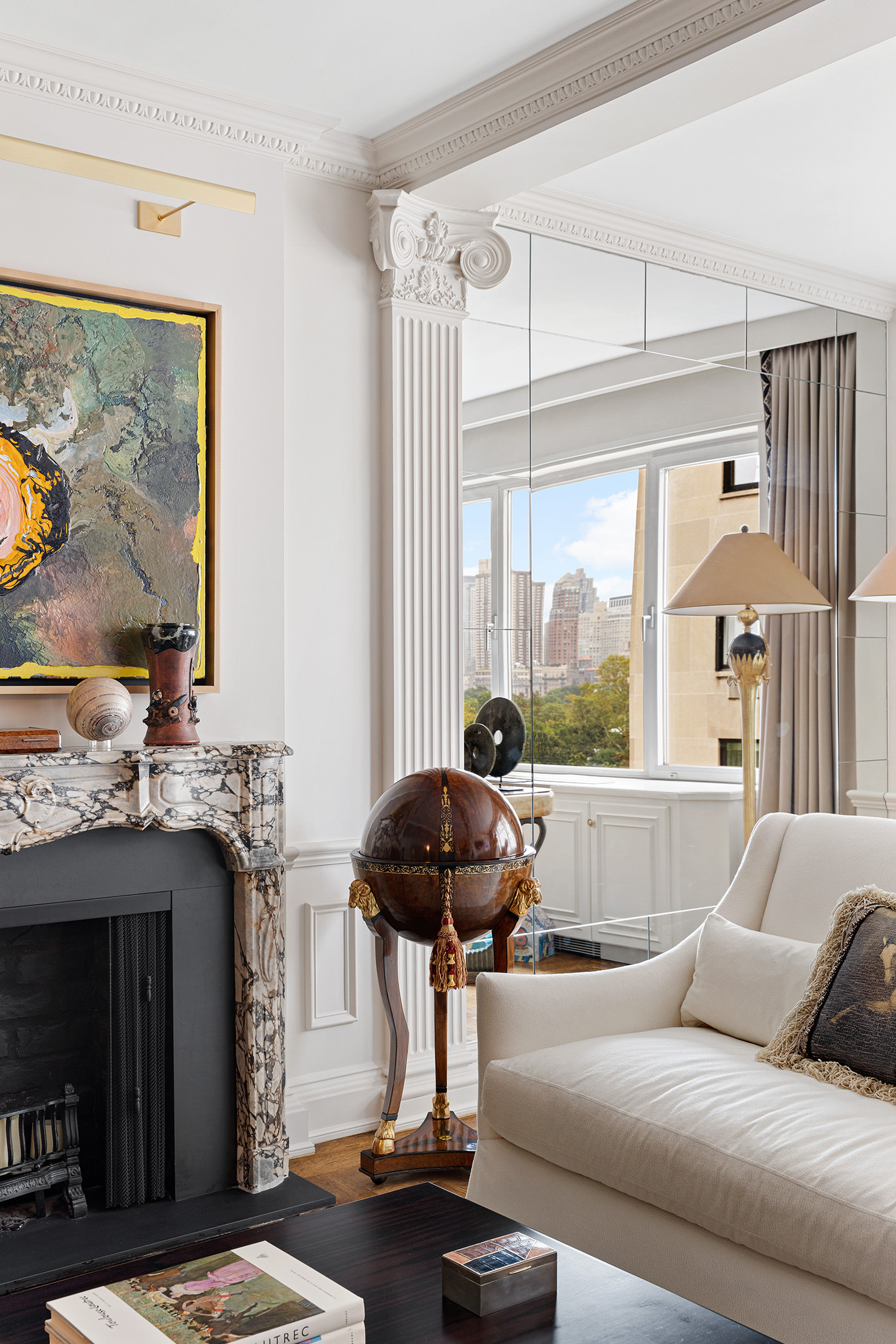 930 5th Avenue, Unit 11D Manhattan, NY 10021 - Photo 3 of 11 a living room with furniture and a large window