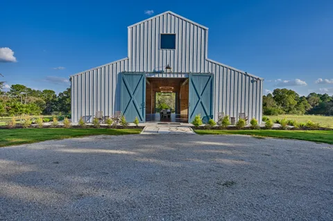 a large kitchen with a table and chairs