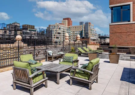 a view of a terrace with seating area and furniture