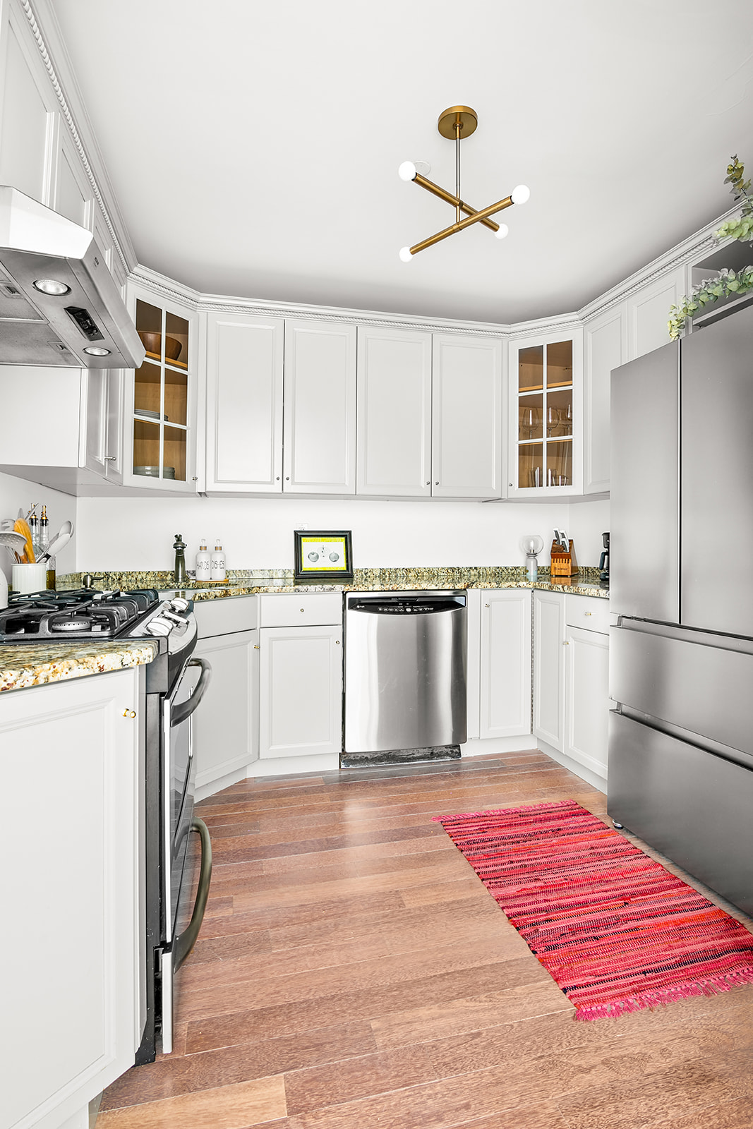 127 4th Place, Unit 2A Brooklyn, NY 11231 - Photo 3 of 6 a kitchen with granite countertop stainless steel appliances a sink and cabinets