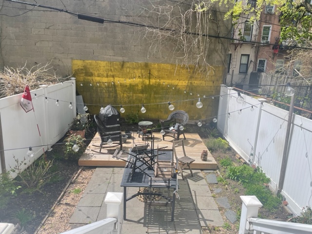 250 57th Street Brooklyn, NY 11220 - Photo 14 of 15 a picture of a table and chairs in patio