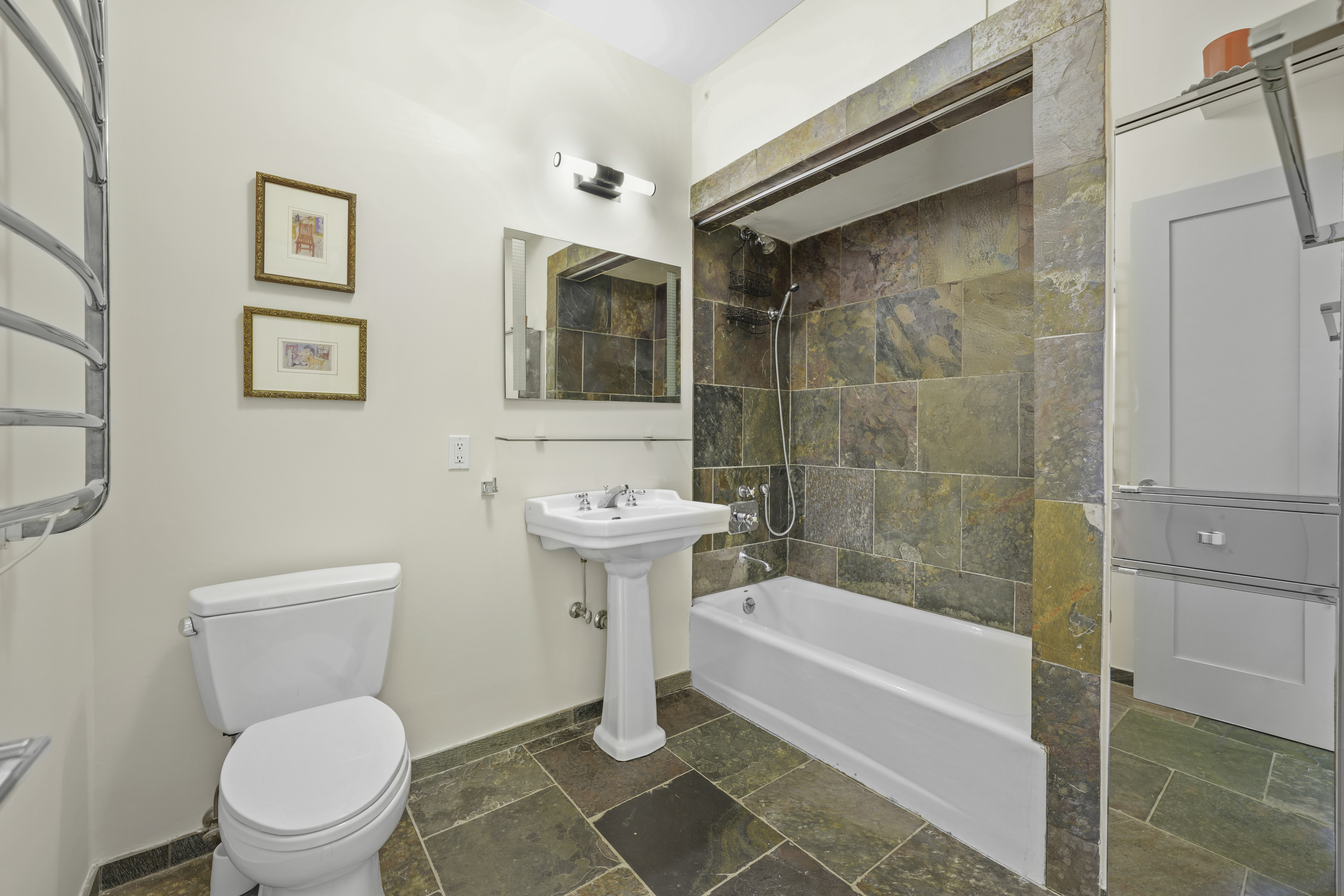 133 West 123rd Street Manhattan, NY 10027 - Photo 23 of 31 a bathroom with a toilet a sink and bathtub