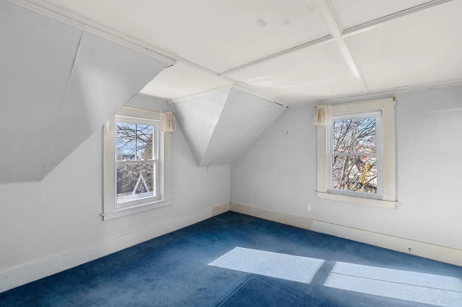 an empty room with windows