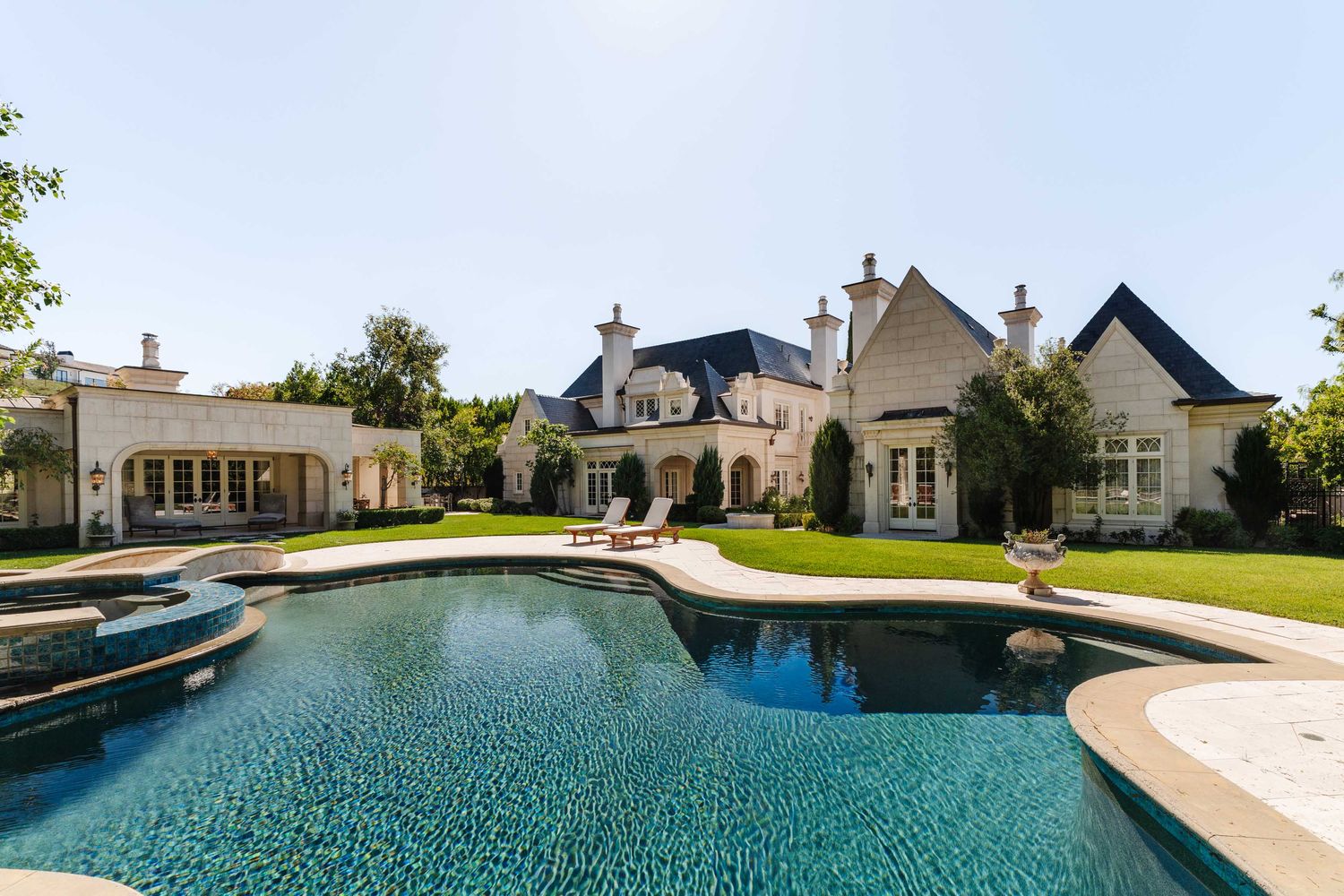 a view of a patio with swimming pool table and chairs