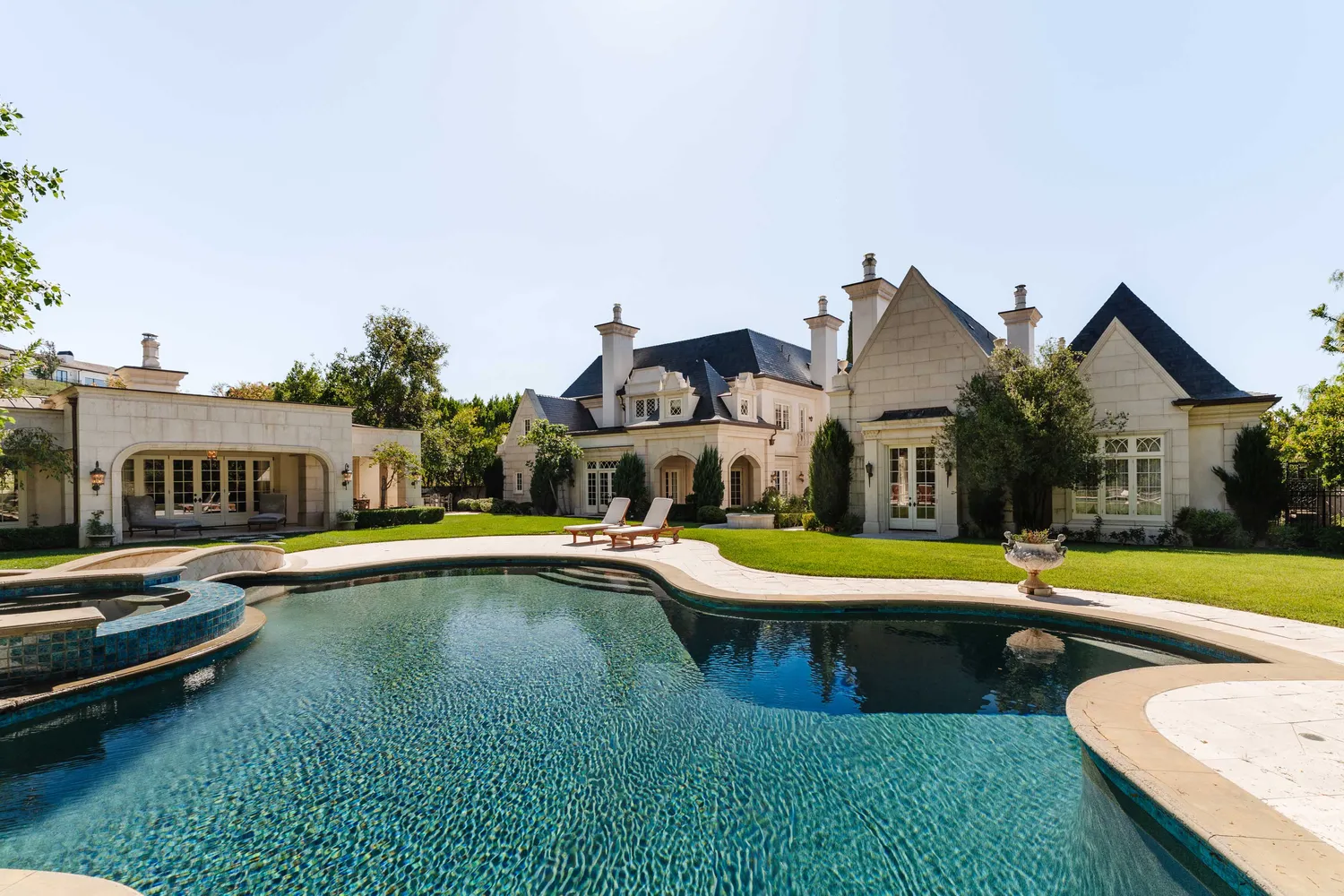 a view of a patio with swimming pool table and chairs