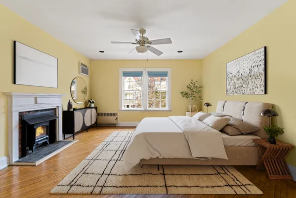 a bedroom with a bed and a fireplace