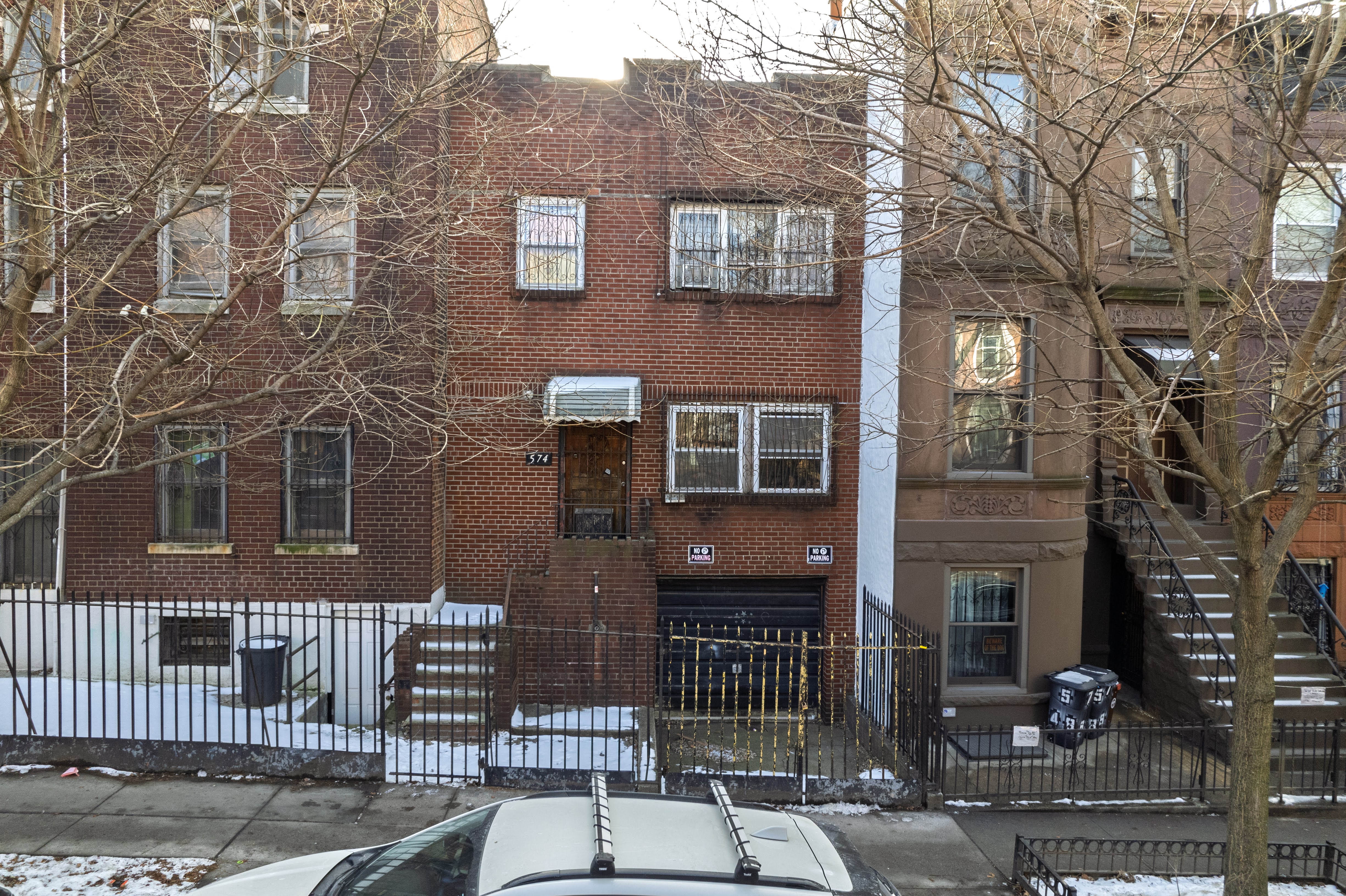4802 6th Avenue Brooklyn, NY 11220 - Photo 11 of 21 a front view of a house with iron fence