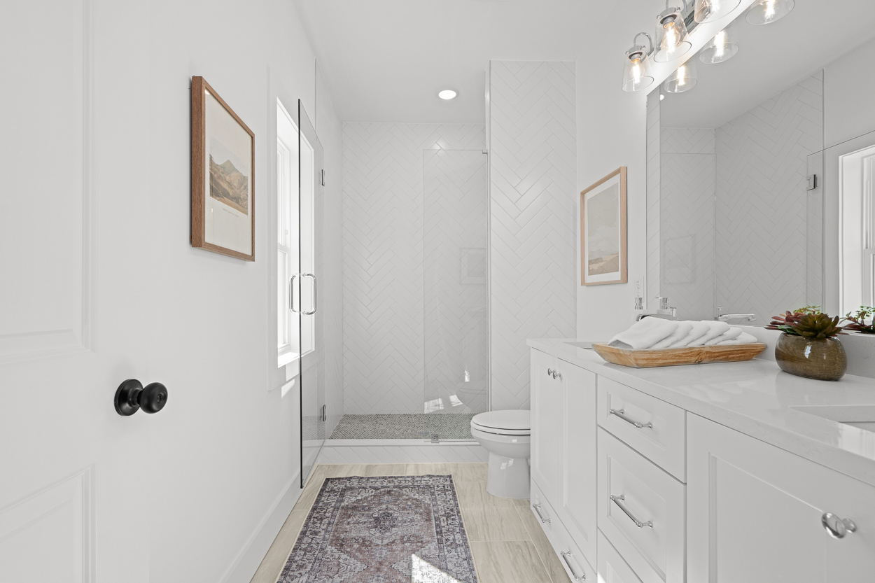 369 Kings Landing Atlanta, GA 30354 - Photo 19 of 41 a spacious bathroom with a granite countertop sink a toilet and a mirror