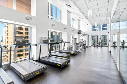 a living room with furniture pool table and a large window