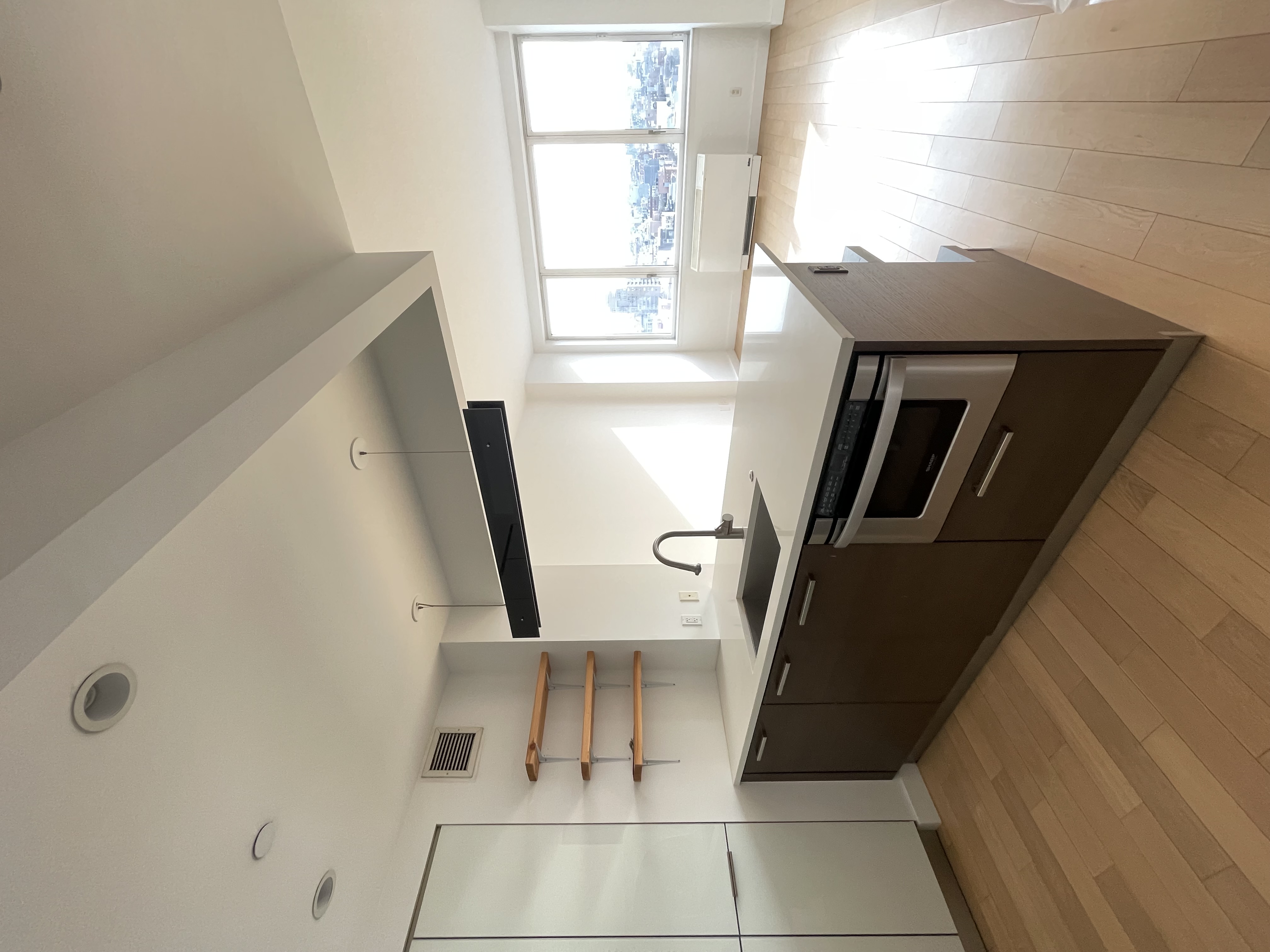 22 North 6th Street, Unit 17I Brooklyn, NY 11249 - Photo 4 of 21 a kitchen with stainless steel appliances granite countertop a sink and a stove