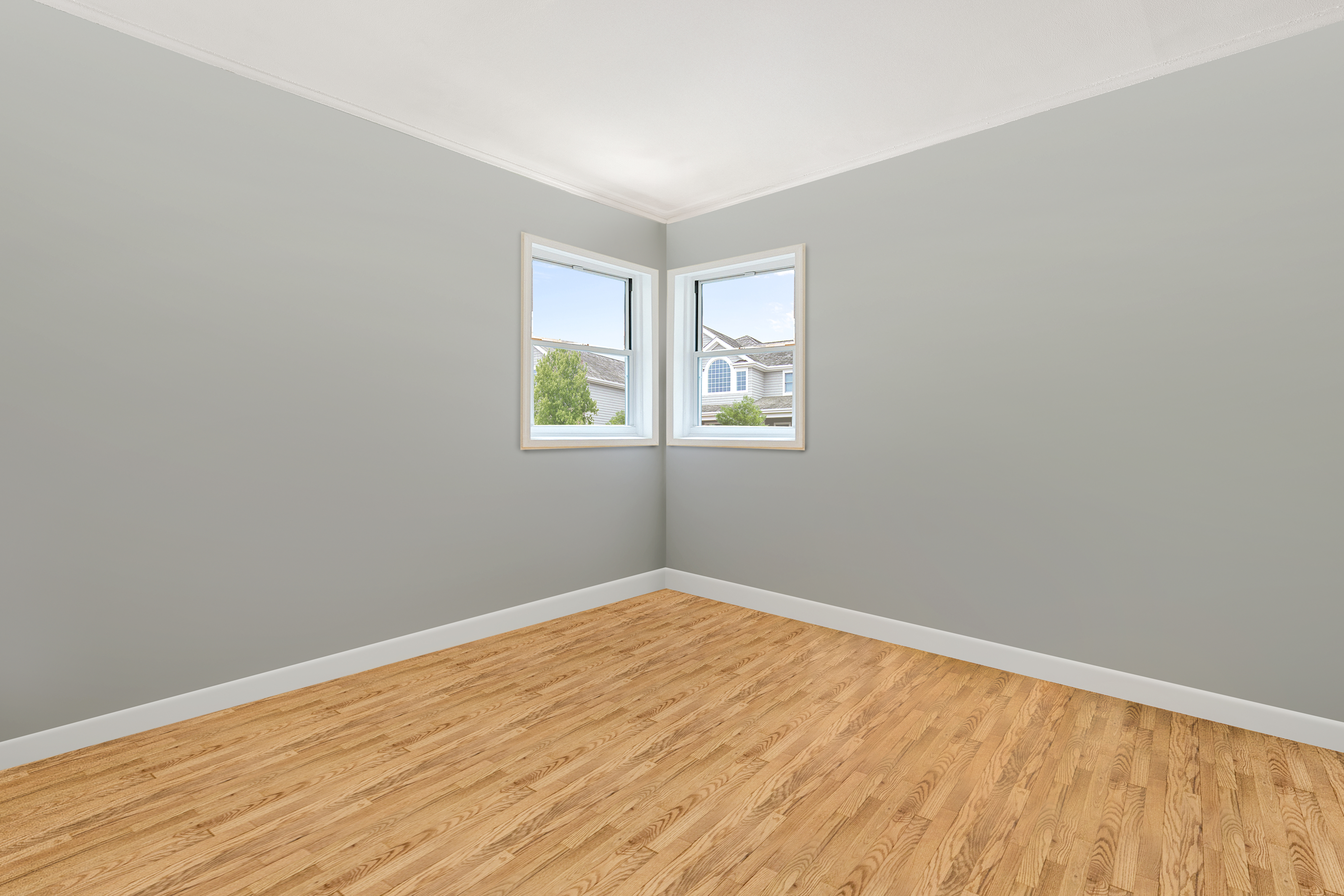 241-12 148th Avenue Queens, NY 11422 - Photo 5 of 15 an empty room with wooden floor and windows