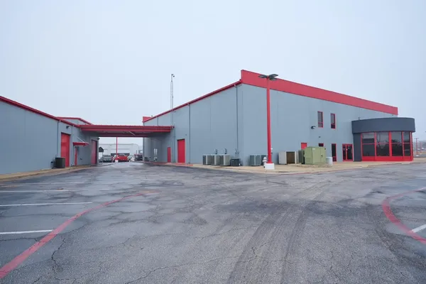 a work room with furniture and wooden floor