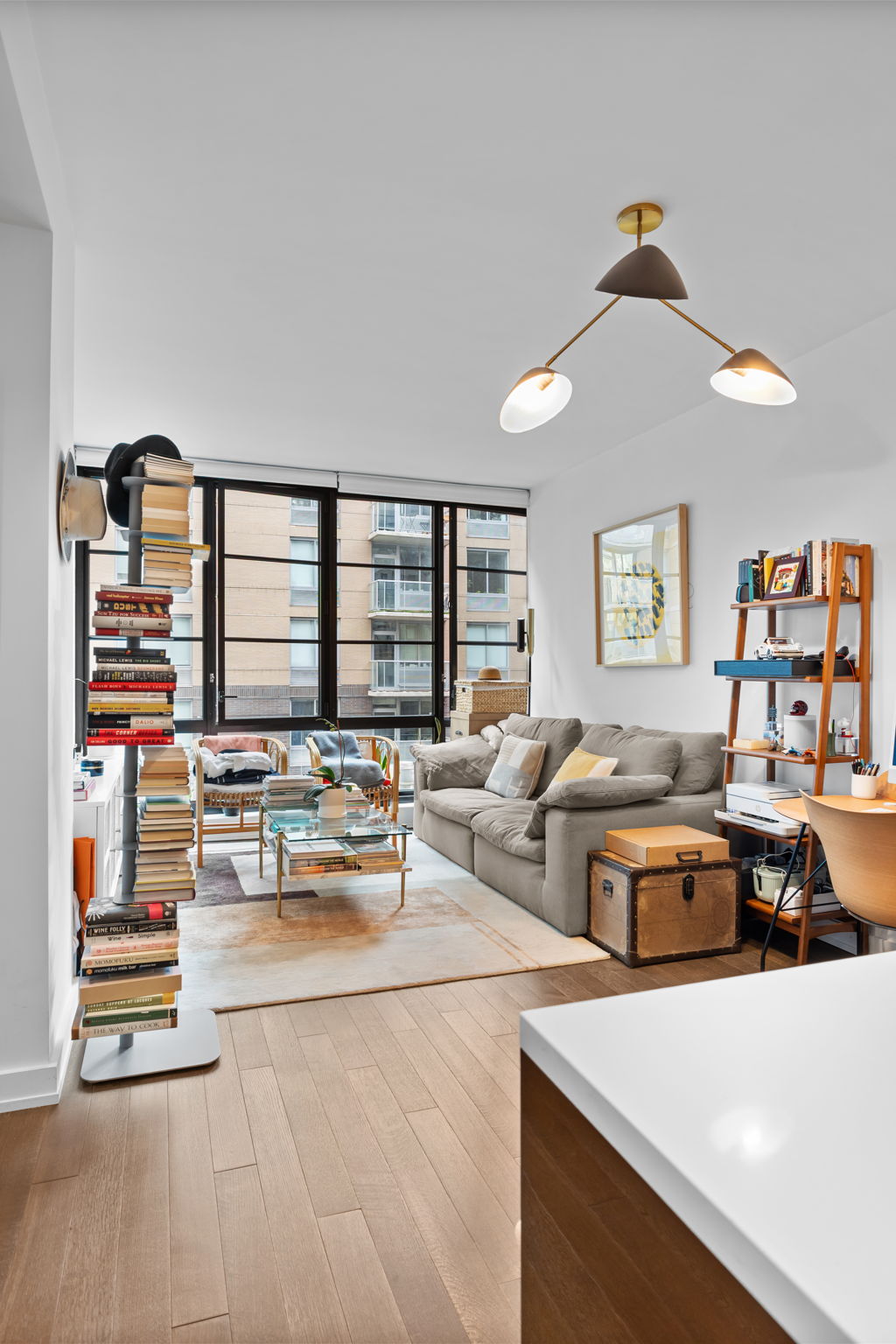261 West 25th Street, Unit 4A Manhattan, NY 10001 - Photo 3 of 16 a living room with furniture and large window