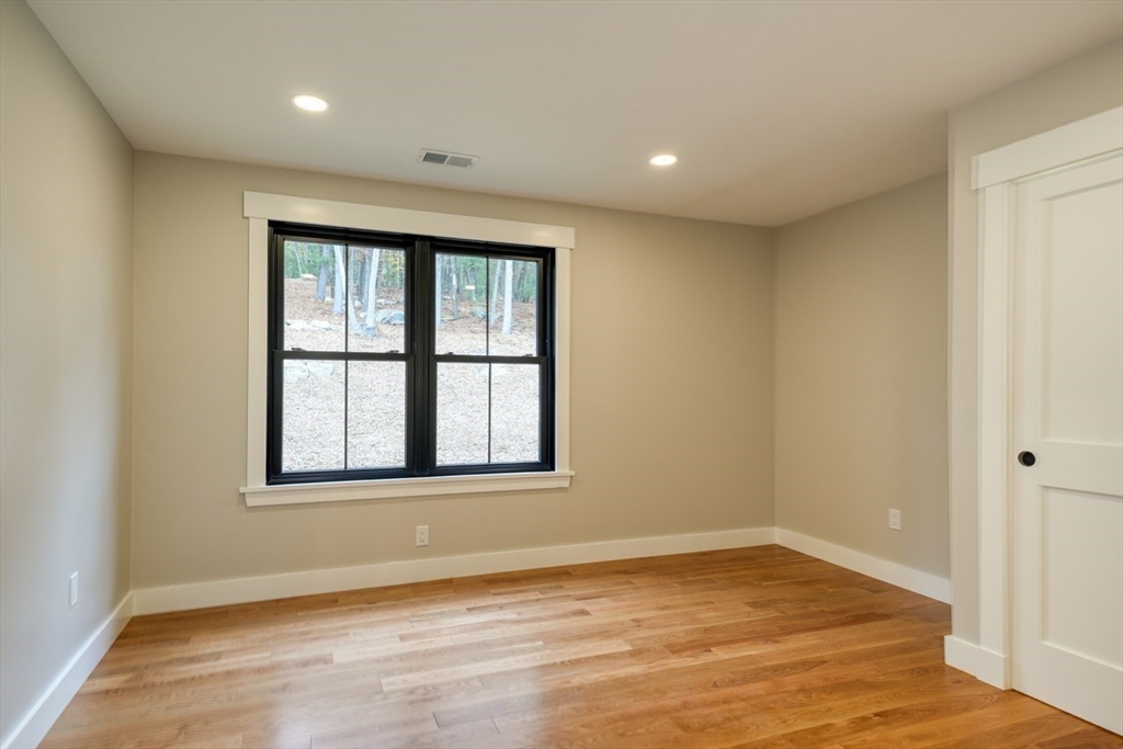 171 Randall Road Berlin, MA 01503 - Photo 28 of 41 an empty room with wooden floor and windows