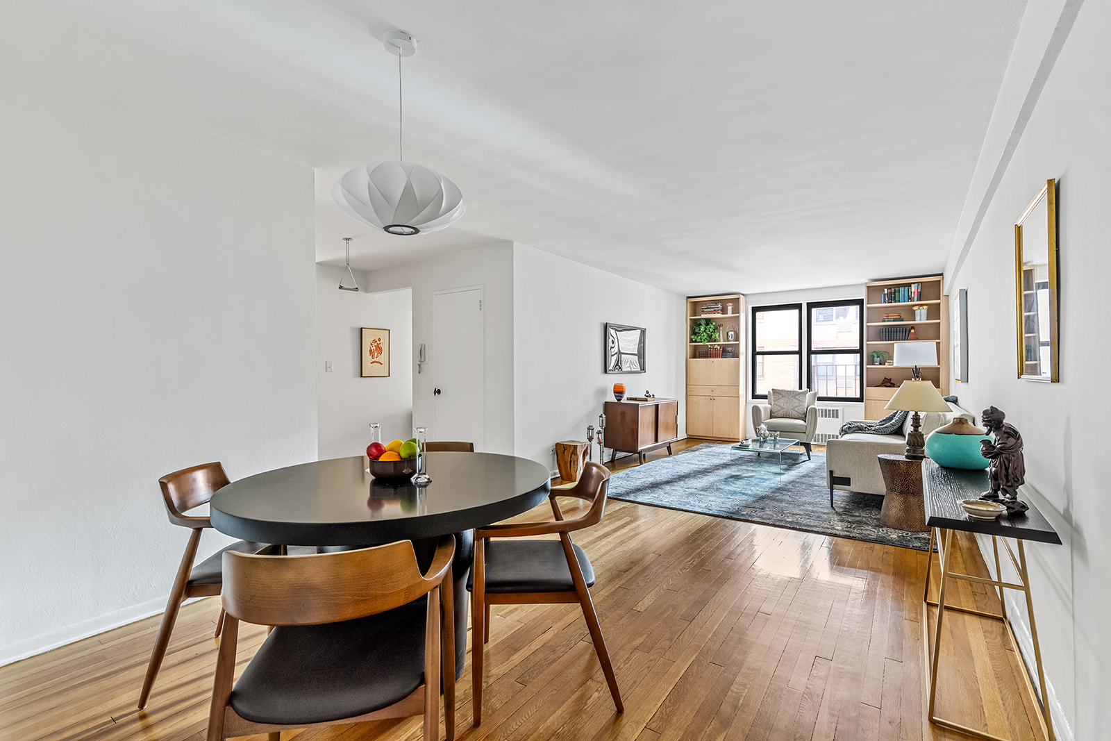 330 East 80th Street, Unit 5O Manhattan, NY 10075 - Photo 1 of 7 a view of a dining room with furniture window and wooden floor