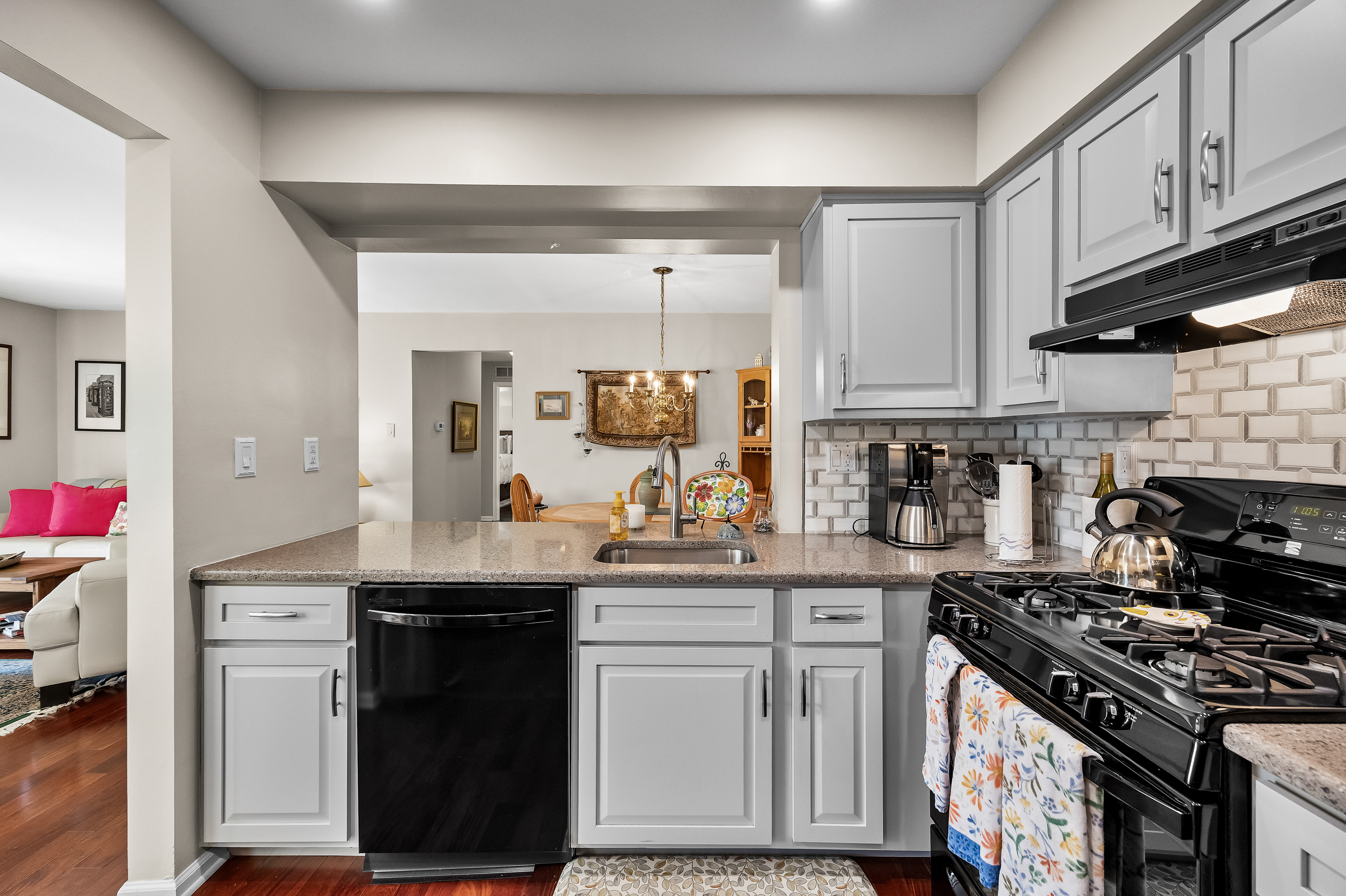 1007 A Yarmouth Lane Mount Laurel, NJ 08054 - Photo 11 of 27 a kitchen with stainless steel appliances granite countertop a sink stove and cabinets