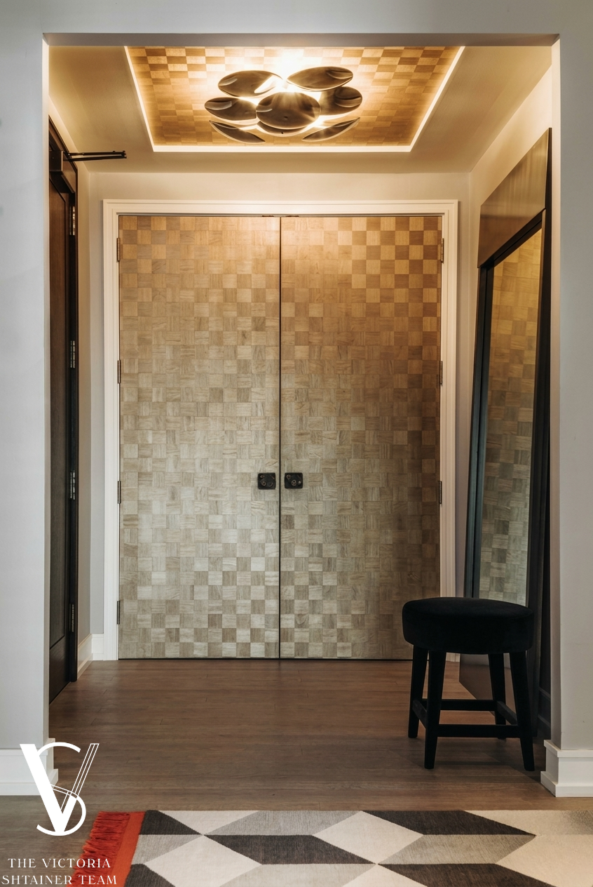 151 East 58th Street, Unit 38A Manhattan, NY 10022 - Photo 10 of 13 a room with a wooden floor and a table chair