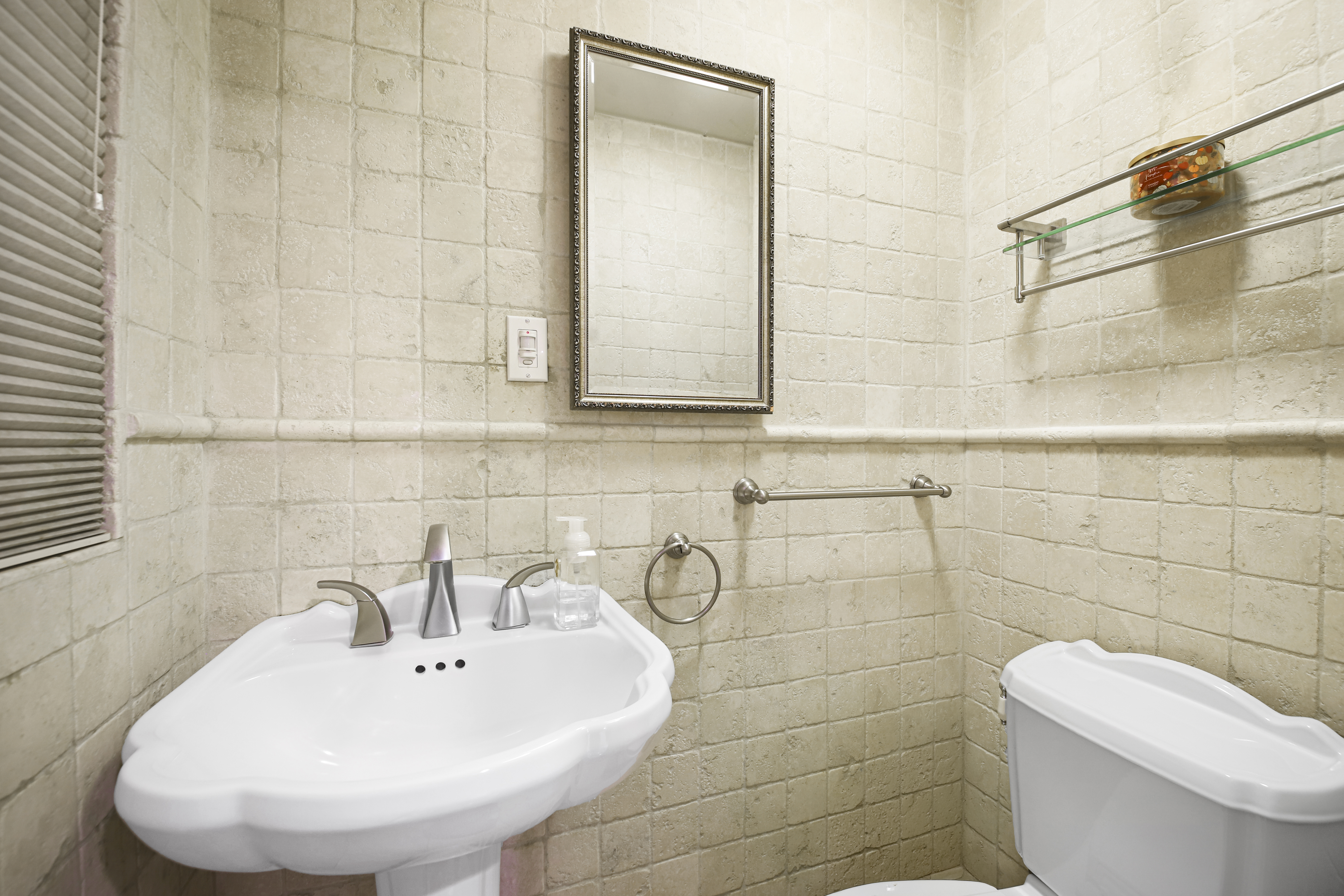 2310 East 66th Street Brooklyn, NY 11234 - Photo 8 of 24 a bathroom with a toilet sink and mirror