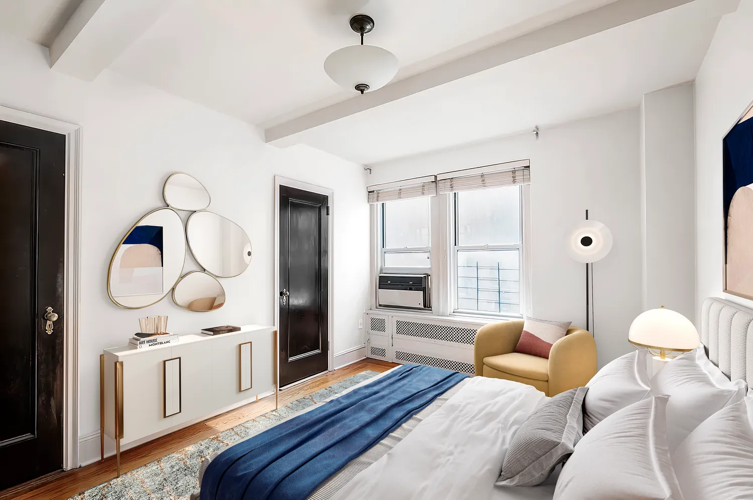 a living room with furniture a chandelier and a large window