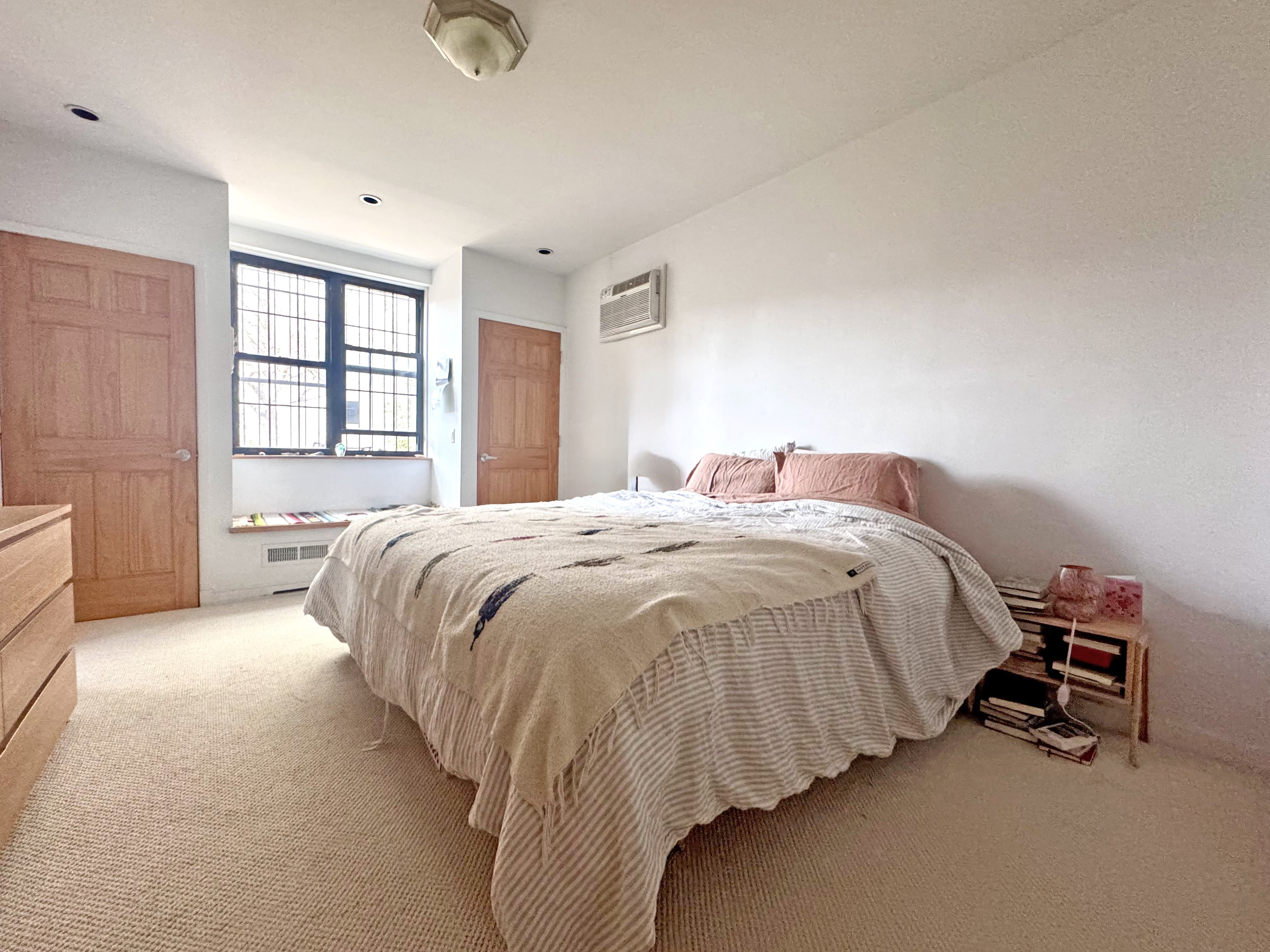 658 Classon Avenue Brooklyn, NY 11238 - Photo 9 of 15 a spacious bedroom with a bed and a window
