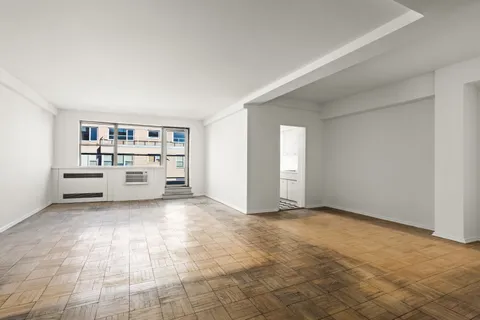 a view of a room with cabinet and windows