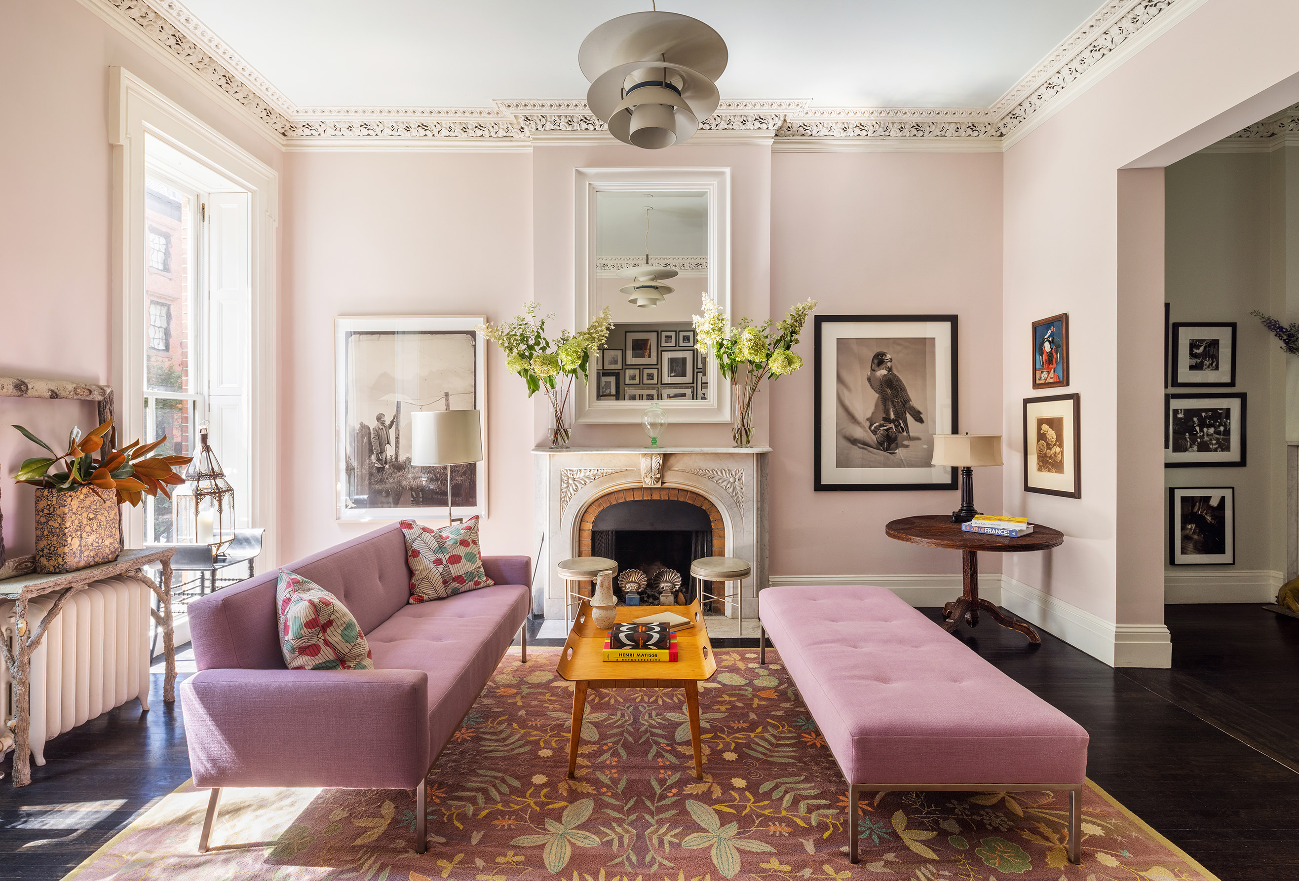 25 Perry Street Manhattan, NY 10014 - Photo 4 of 32 a living room with furniture and a fireplace
