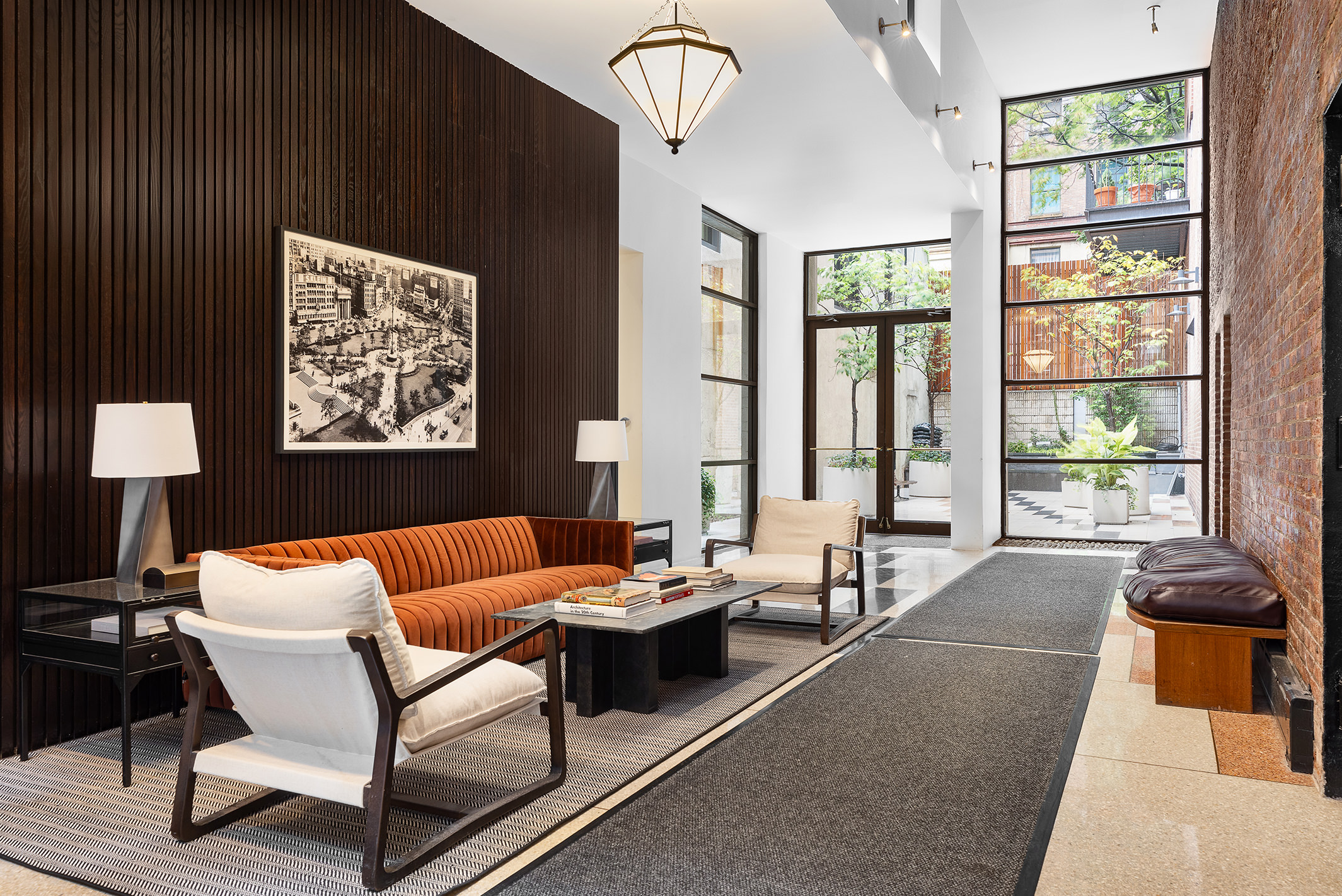 114 East 13th Street, Unit PHA Manhattan, NY 10003 - Photo 6 of 8 a living room with furniture and large windows