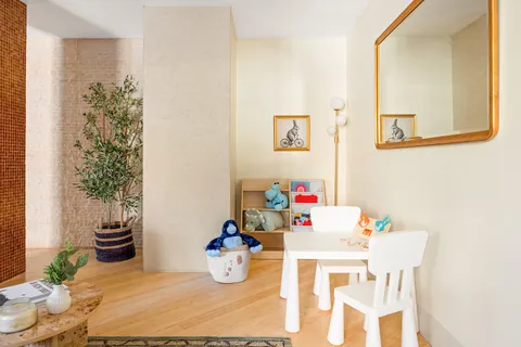 a view of a dining room with a table and chairs