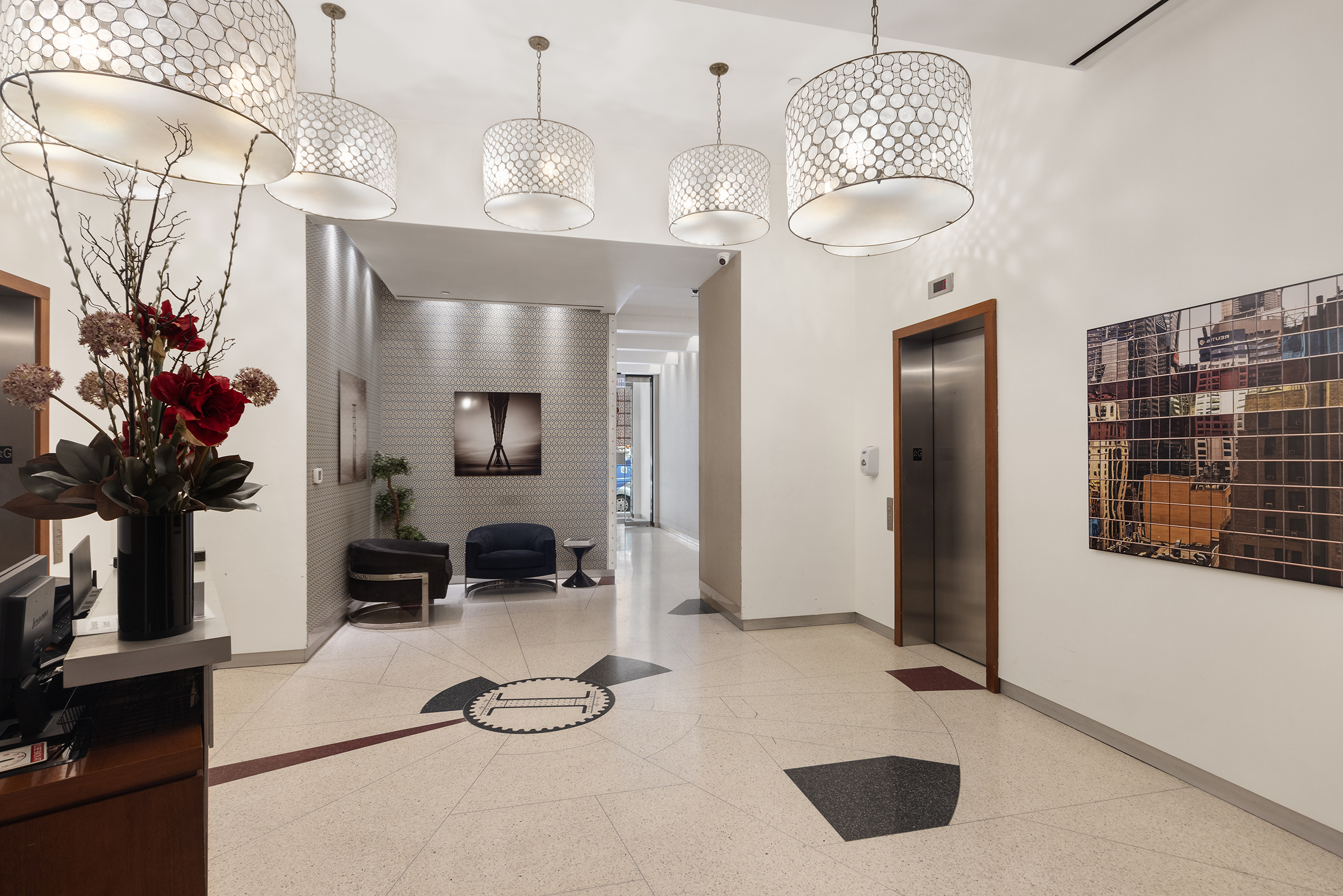 109 Greene Street, Unit 2C Manhattan, NY 10012 - Photo 11 of 13 a view of a livingroom with furniture and a chandelier